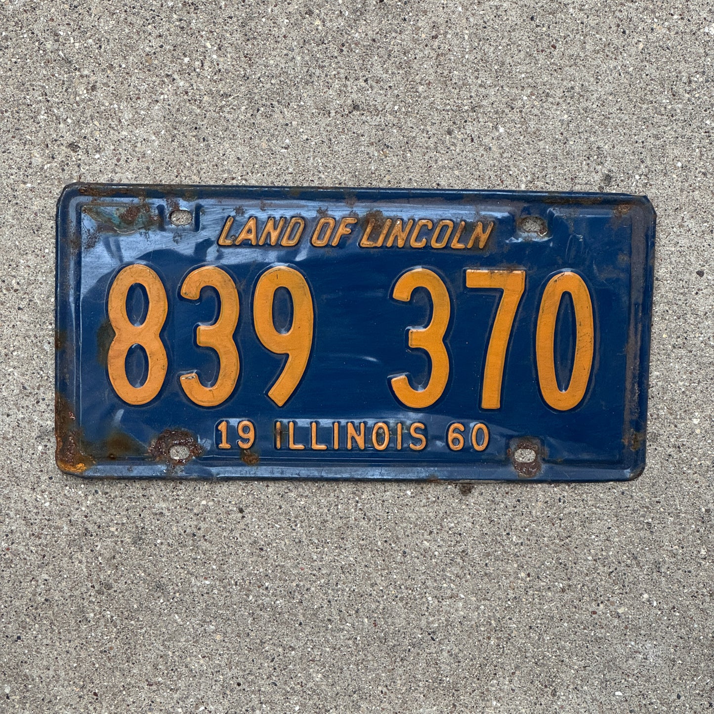 Photo of a 1960 Illinois License Plate Auto Tag 2 Vintage Garage Orange Blue 839 370 with original patina