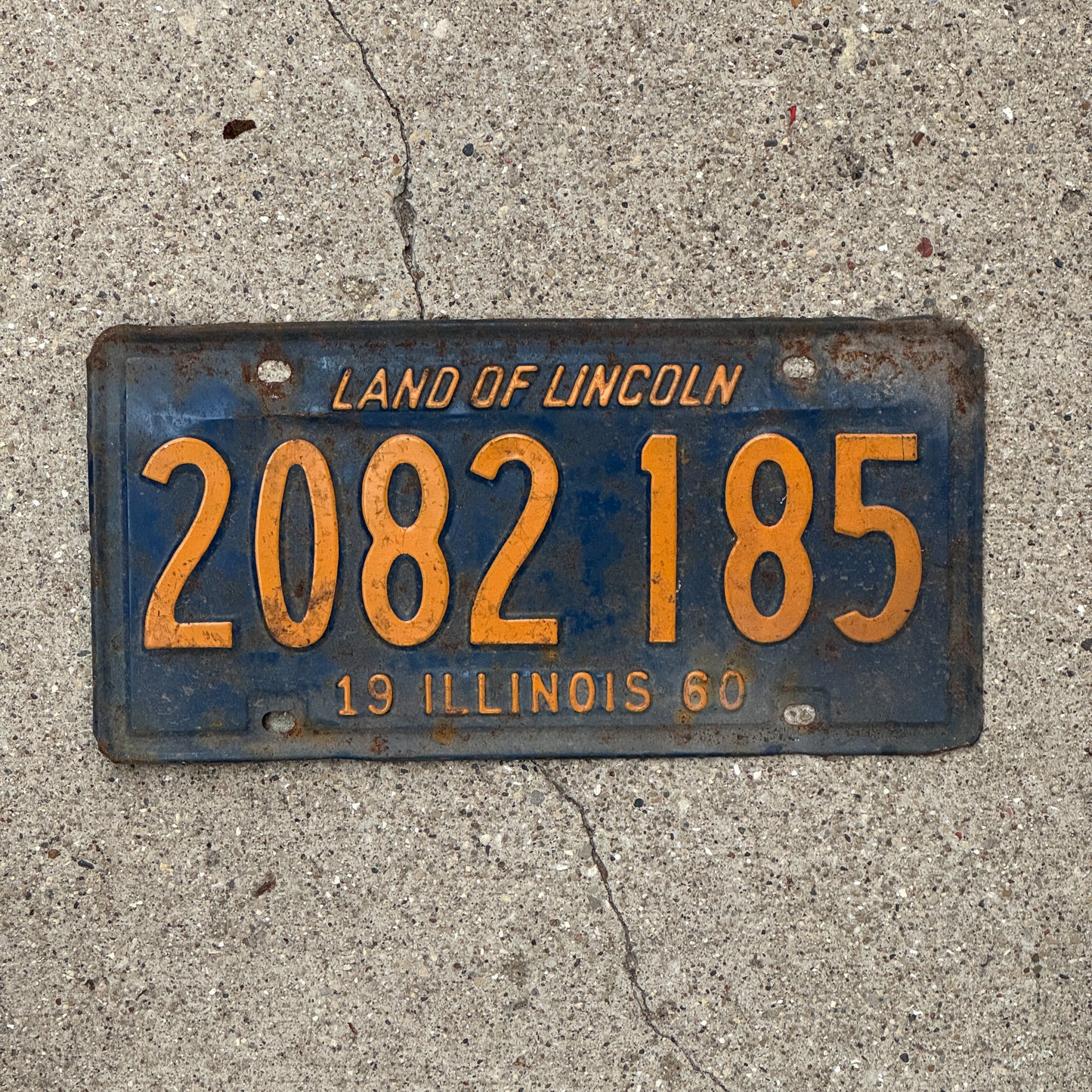 Photo of a 1960 Illinois License Plate Auto Tag Garage Decor Vintage Orange Blue 2 082 185 with original patina