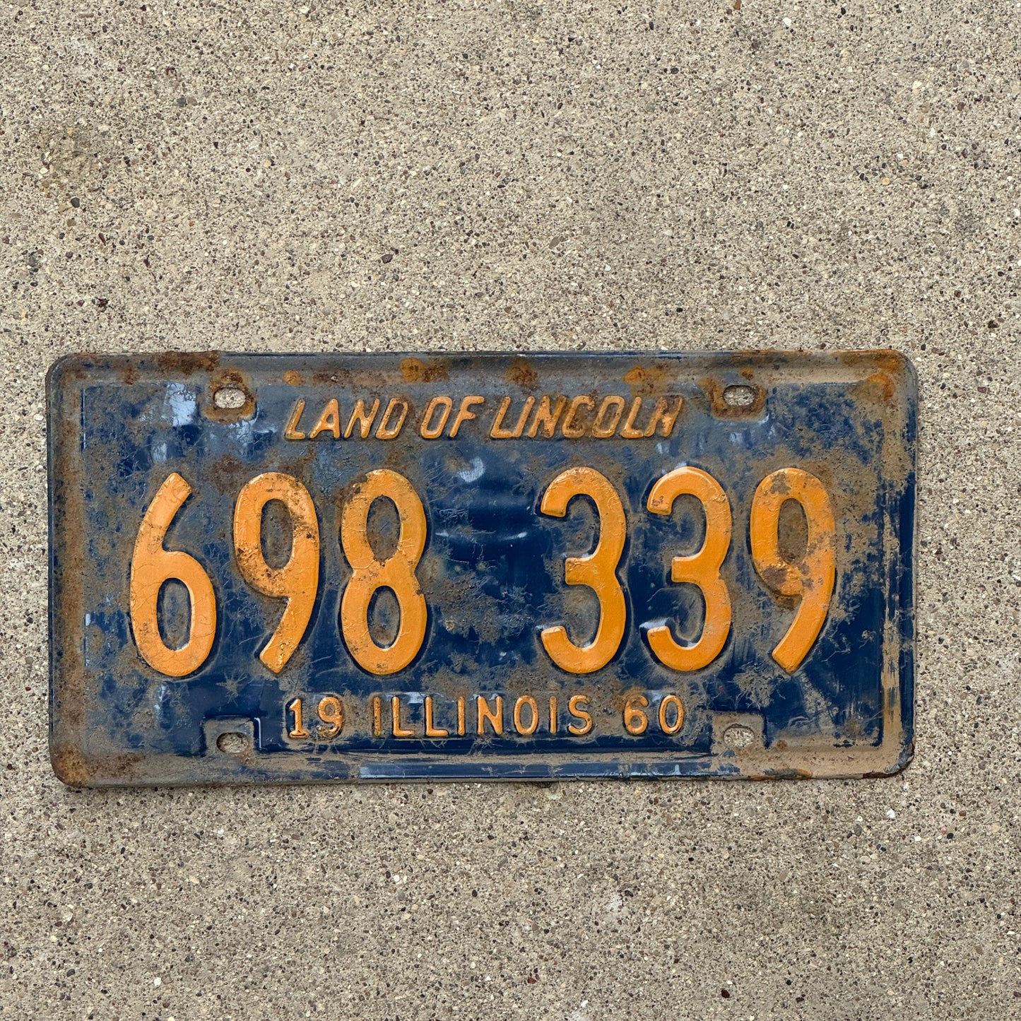 Photo of a 1960 Illinois License Plate Auto Tag Garage Decor Vintage Orange Blue 698 339 with original patina
