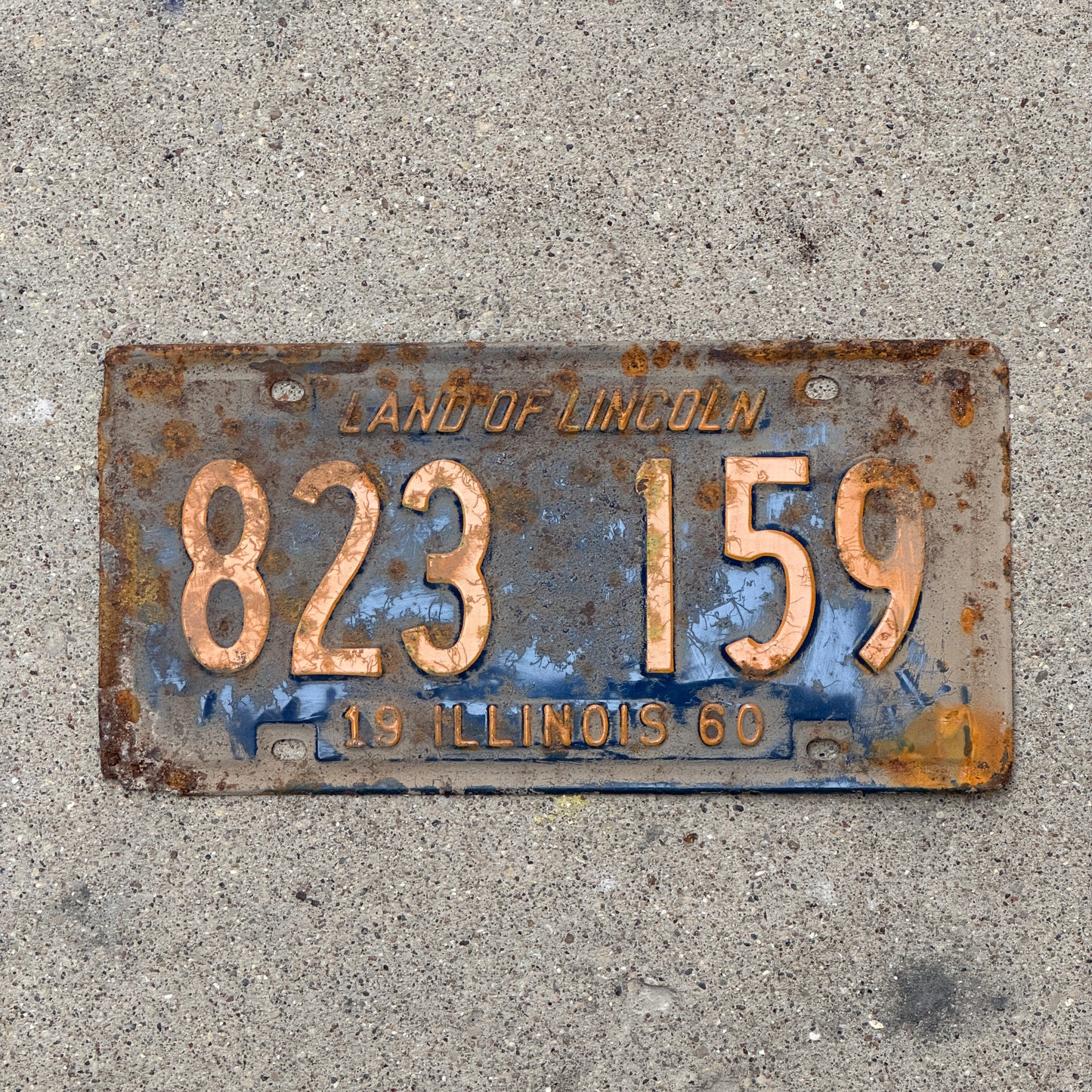 Photo of a 1960 Illinois License Plate Auto Tag Garage Decor Vintage Orange Blue 823 159 with original patina