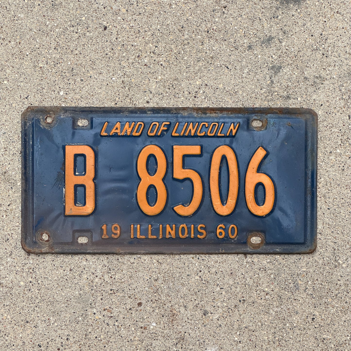 Photo of a 1960 Illinois Truck License Plate Auto Tag Garage Decor Vintage Orange Blue B 8506 with original patina