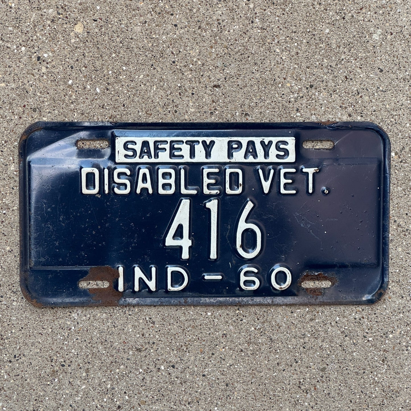 Photo of a 1960 Indiana Disabled Veteran License Plate Auto Tag Garage Decor Vintage DAV 416 with original patina