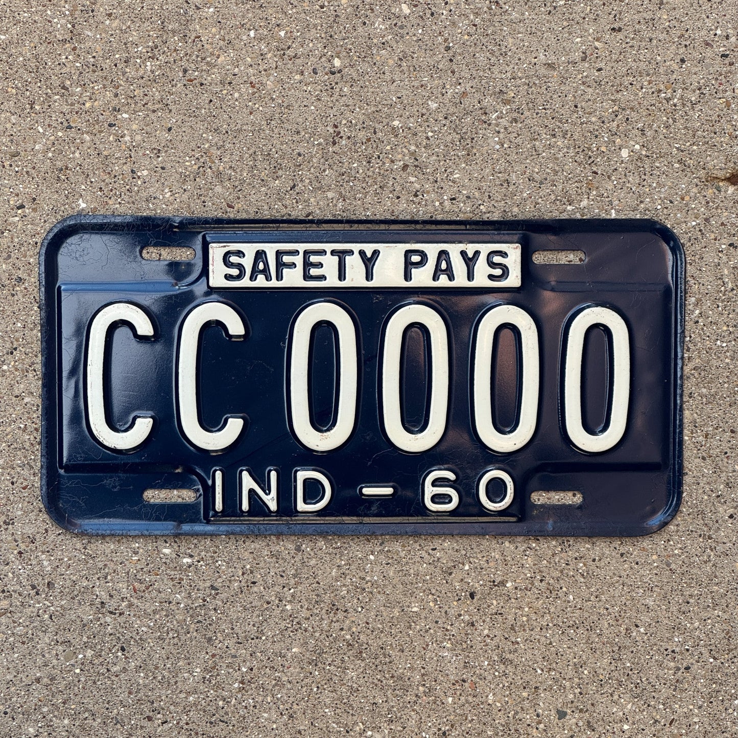Photo of a 1960 Indiana Sample License Plate Auto Tag Garage Decor Vintage CC0000 with original patina