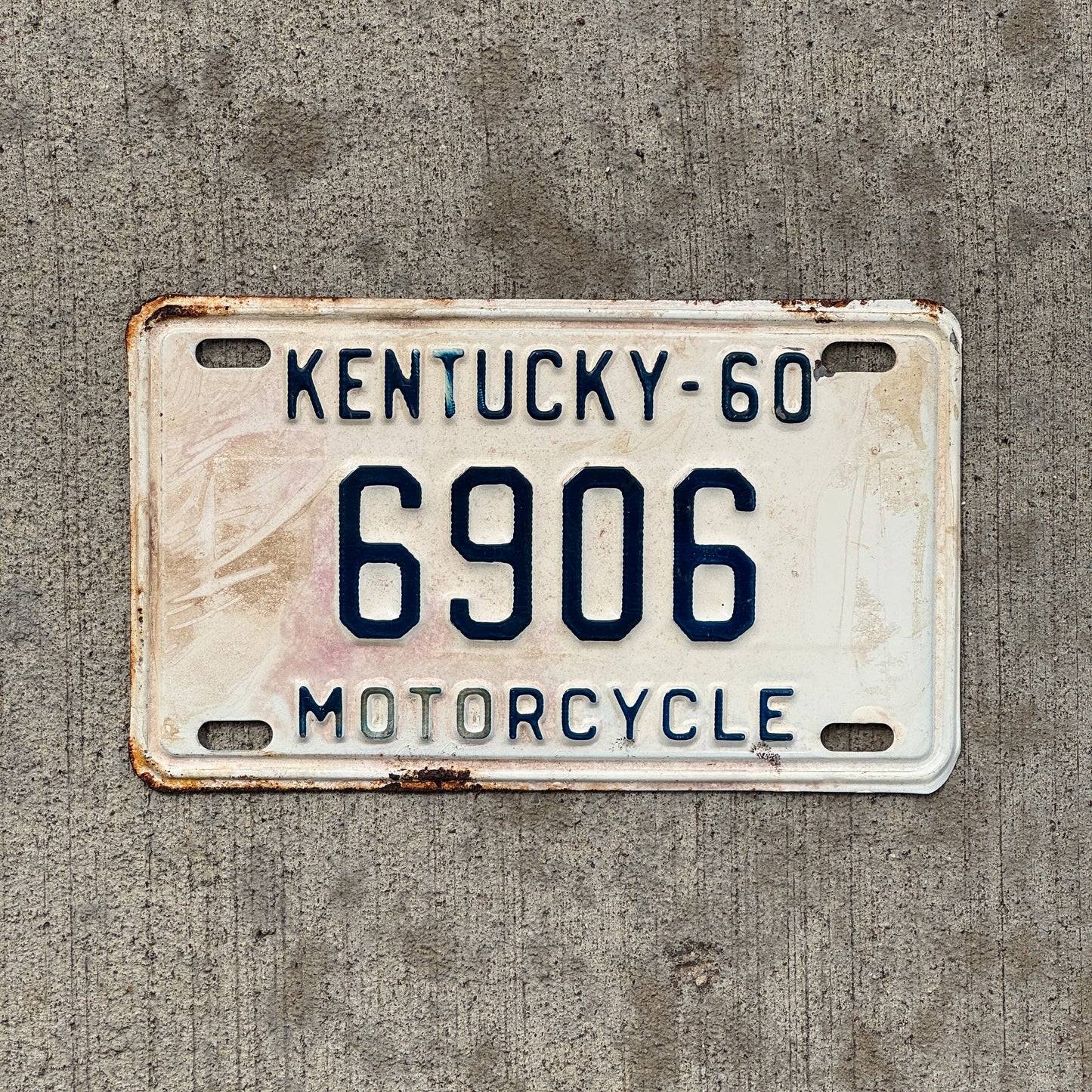 Photo of a 1960 Kentucky Motorcycle License Plate Auto Tag Garage Decor Vintage 6906 with original patina