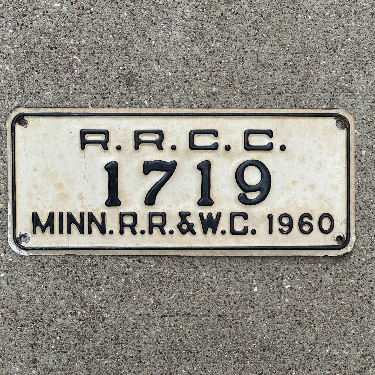 Photo of a 1960 Minnesota RRCC License Plate Auto Tag Garage Decor Vintage RR & WC Railroad Warehouse Commission 1719 with original patina