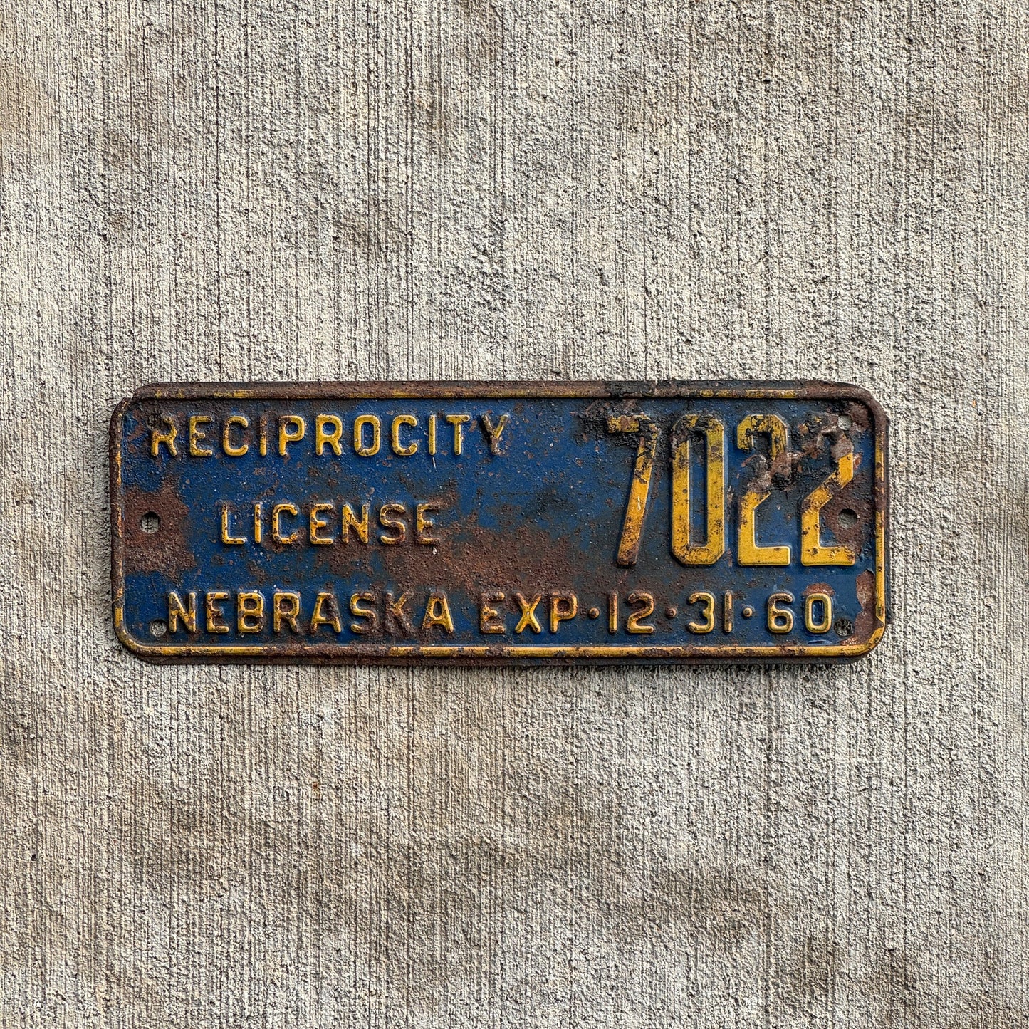 Photo of a 1960 Nebraska Reciprocity License Plate Auto Tag Garage Decor Vintage 7022 with original patina