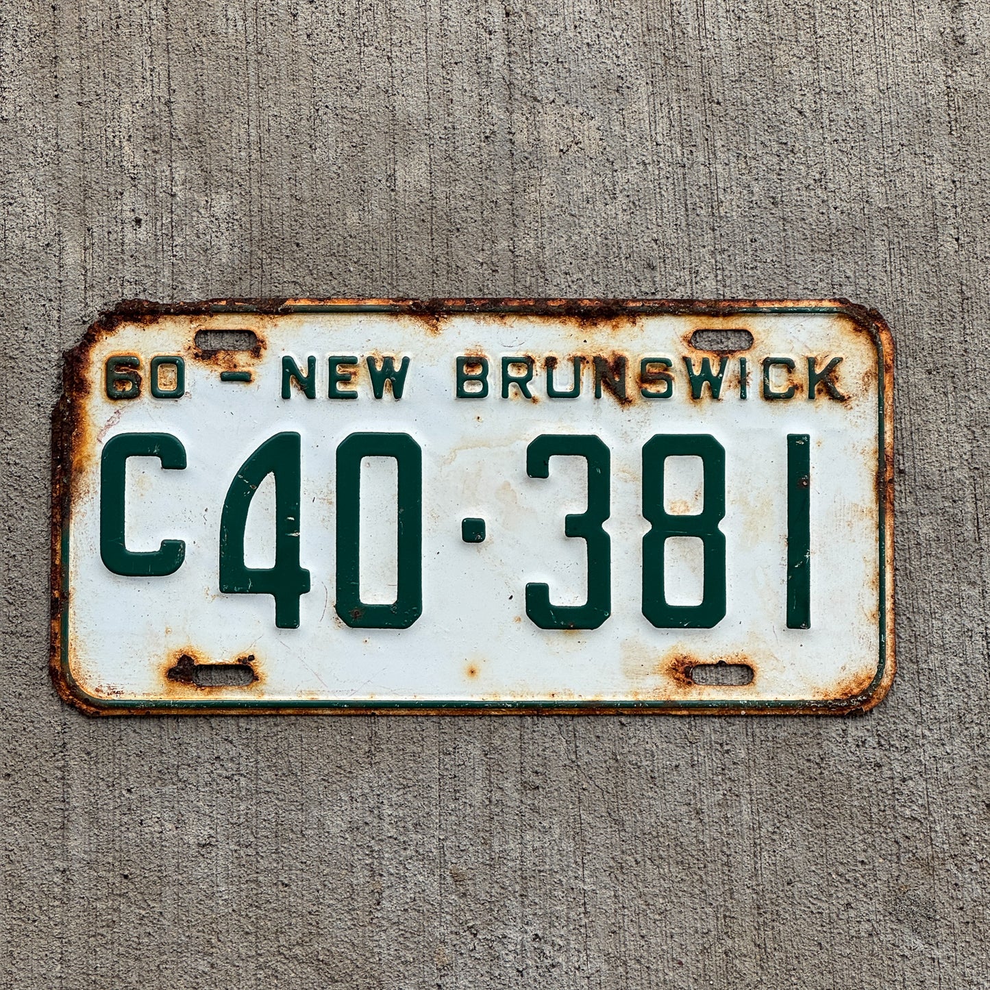 Photo of a 1960 New Brunswick Commercial License Plate Auto Tag 1 Vintage Garage C 40 381 with original patina