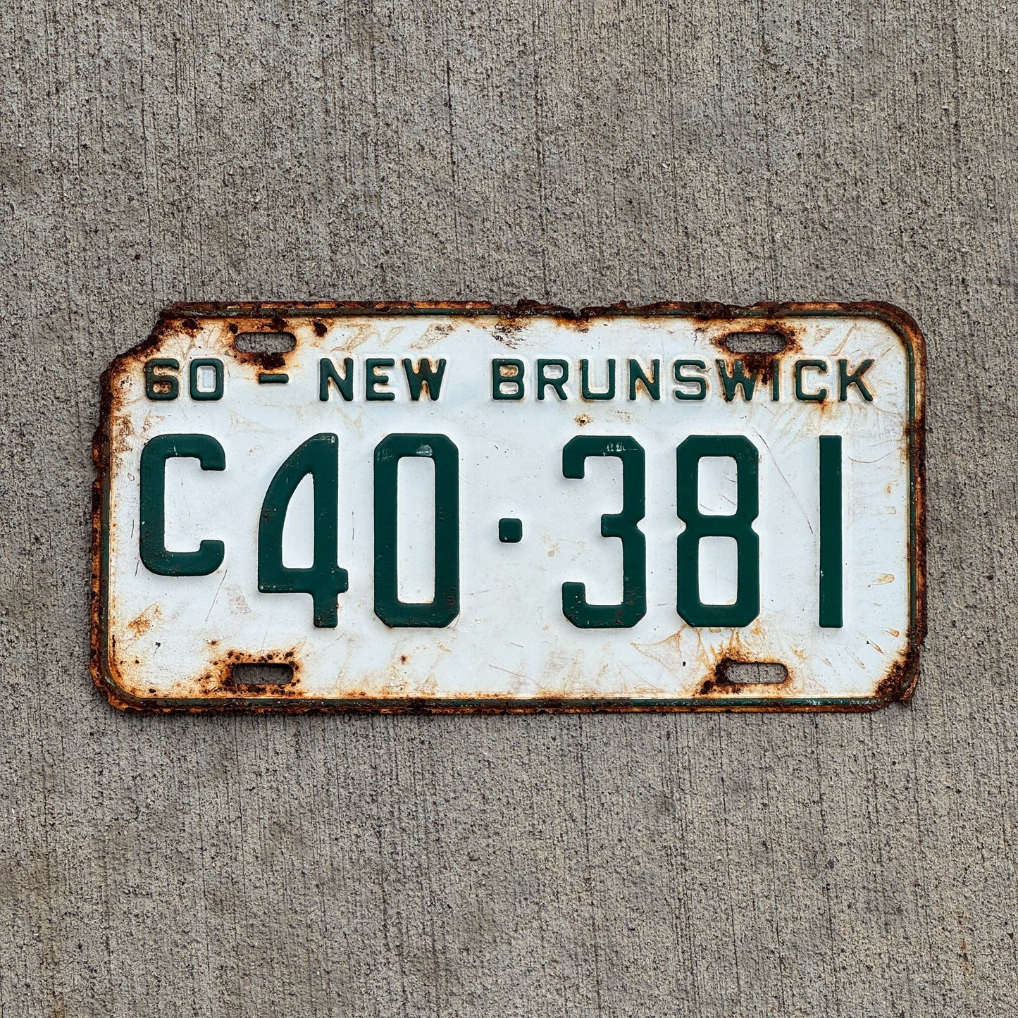 Photo of a 1960 New Brunswick Commercial License Plate Auto Tag 2 Vintage Garage C 40 381 with original patina