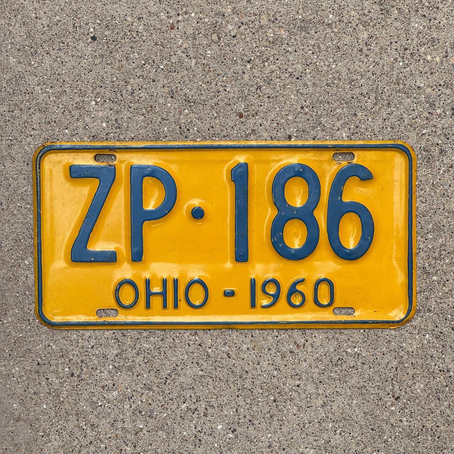 Photo of a 1960 Ohio License Plate Auto Tag Garage Decor Vintage ZP 186 with original patina