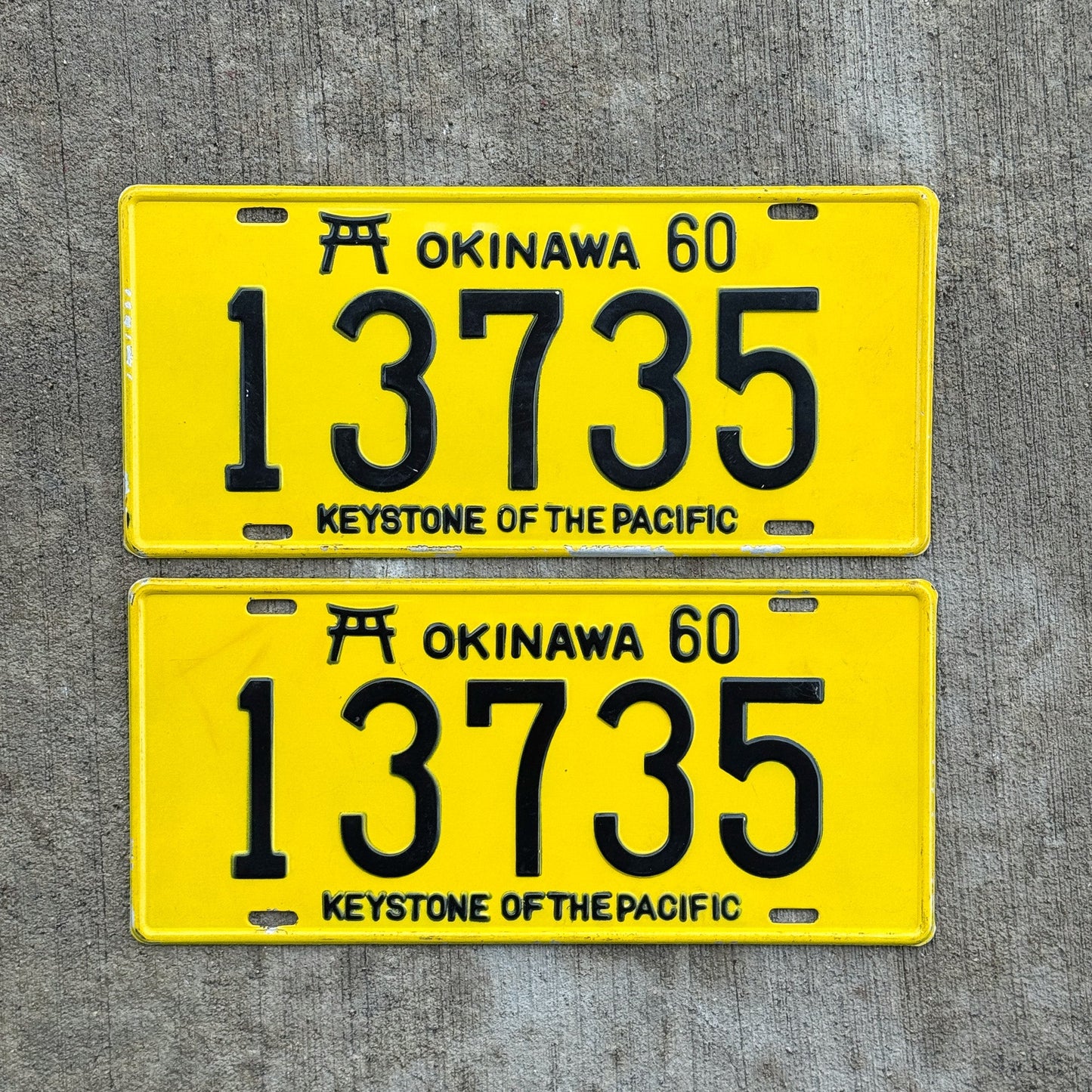 Photo of a 1960 US Forces Okinawa License Plate Pair Auto Tag Garage Decor Vintage Japan Hard to Find 13735 with original patina