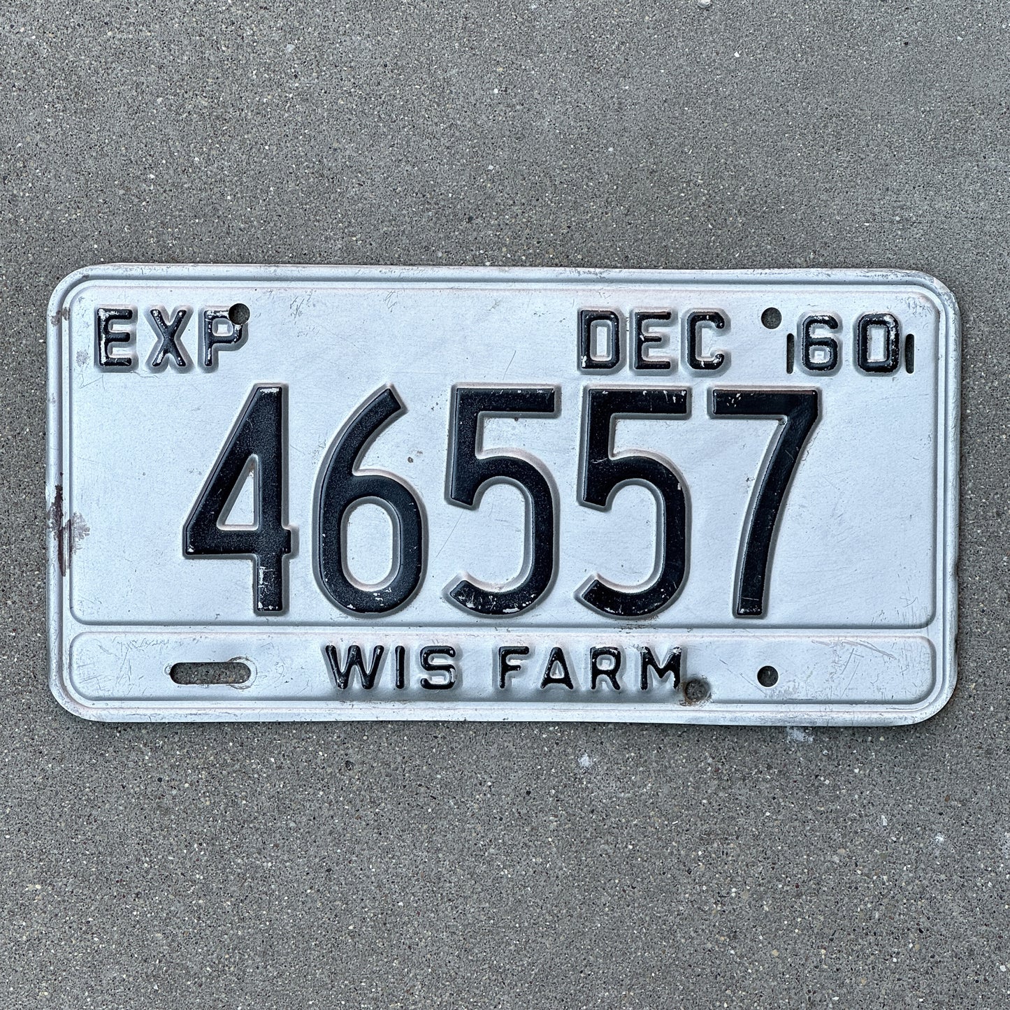 Photo of a 1960 Wisconsin Farm License Plate Auto Tag Garage Decor Vintage 46557 with original patina