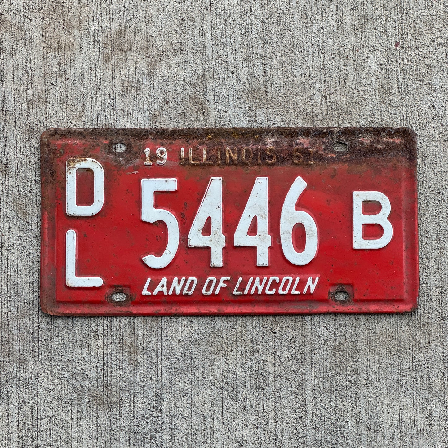 Photo of a 1961 Illinois Dealer License Plate Auto Tag Garage Decor Vintage 5446 B with original patina