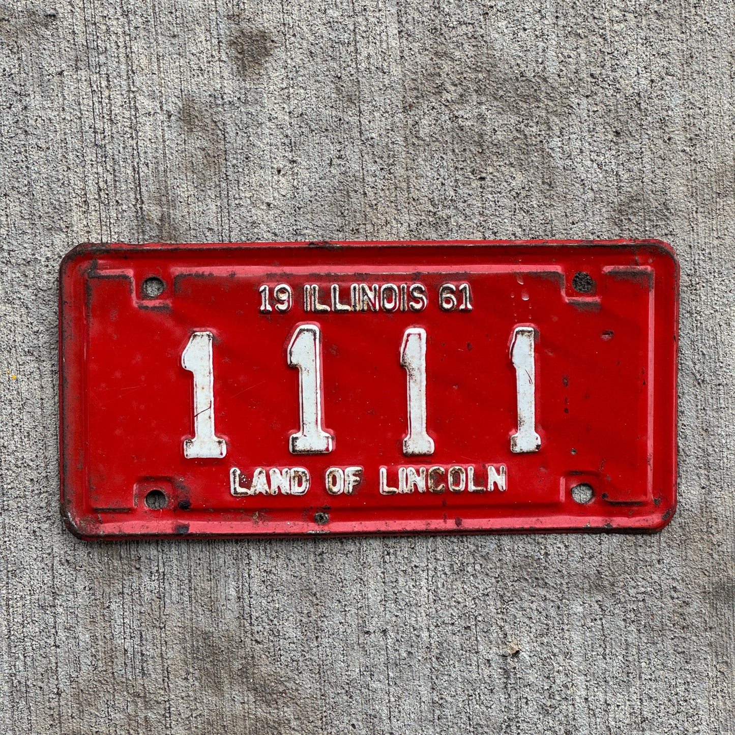 Photo of a 1961 Illinois Motorcycle License Plate Auto Tag Garage Decor Vintage Repeat Repeating 1111 with original patina