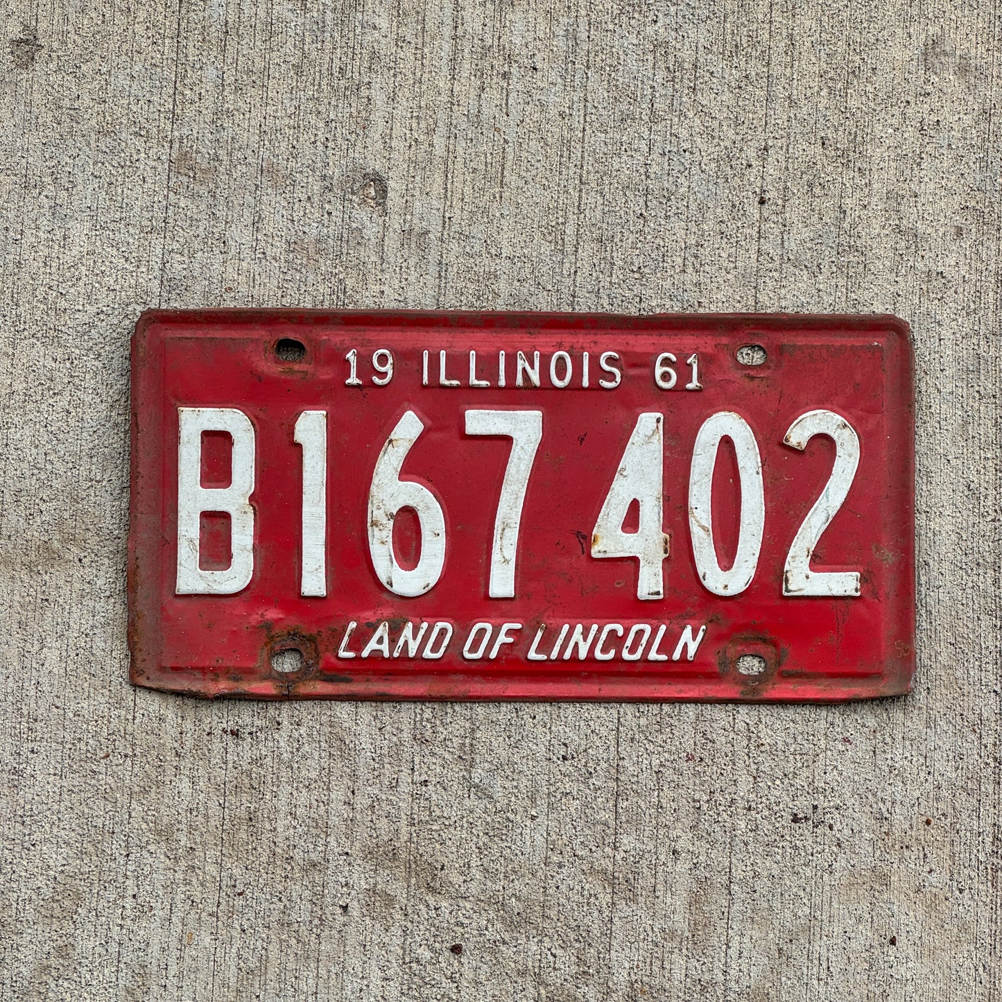 Photo of a 1961 Illinois Truck License Plate Auto Tag Garage Decor Vintage B 167 402 with original patina