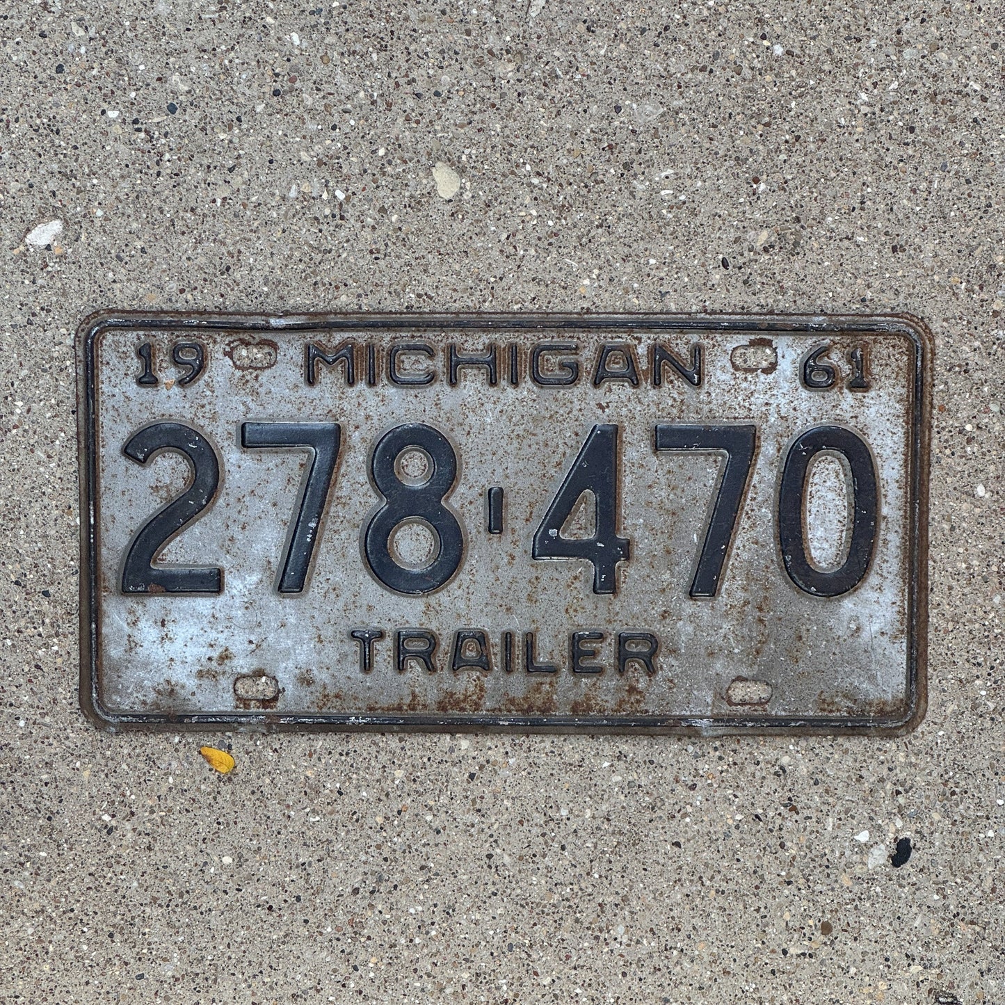 Photo of a 1961 Michigan Trailer License Plate Auto Tag Garage Decor Vintage 278 470