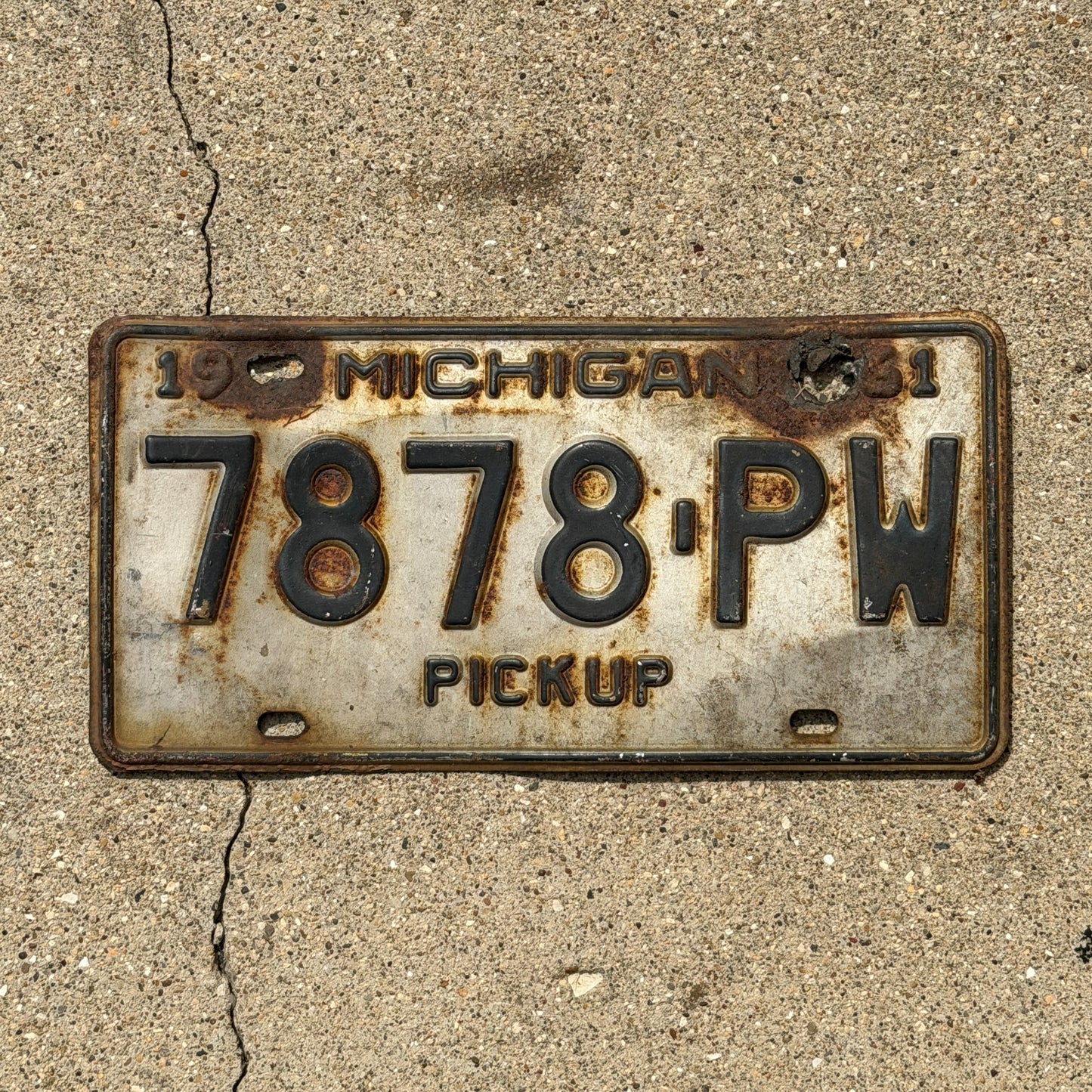 Photo of a 1961 Michigan Truck License Plate Auto Tag Garage Decor Vintage Pickup 7878 PW with original patina