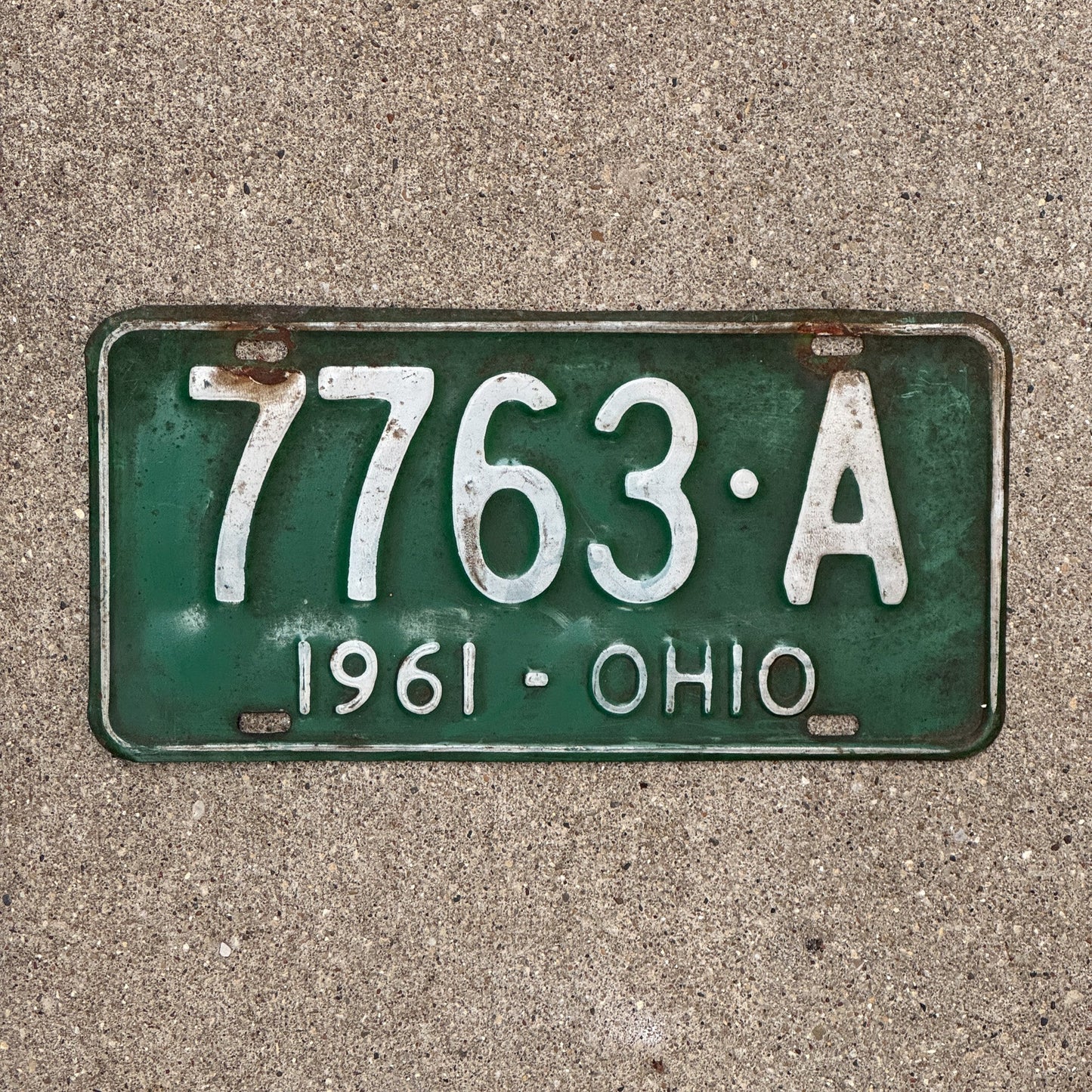 Photo of a 1961 Ohio License Plate Auto Tag Garage Decor Vintage 7763 A with original patina