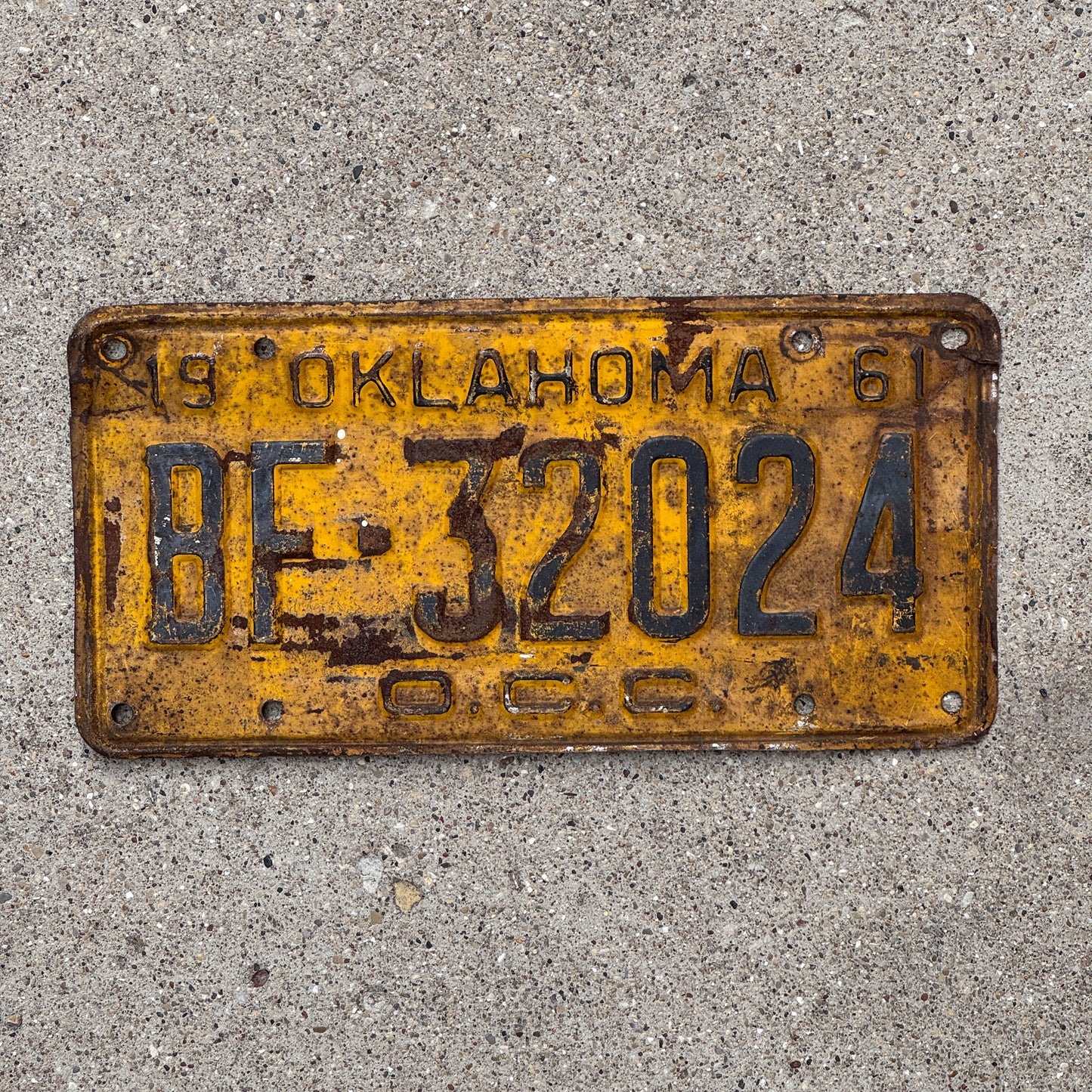Photo of a 1961 Oklahoma Corporation Commission License Plate Auto Tag Garage Decor Vintage BF 32024 with original patina
