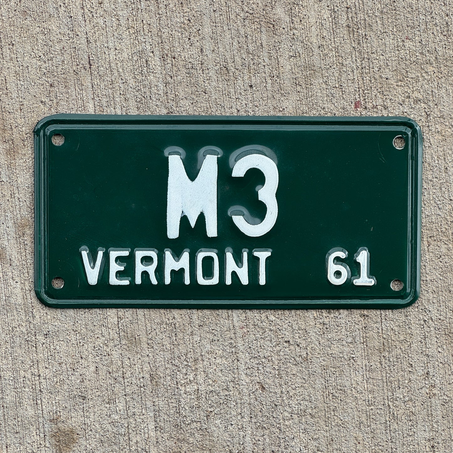 Photo of a 1961 Vermont Motorcycle License Plate Auto Tag 1 Vintage Garage Low Number Single Digit M 3 with original patina
