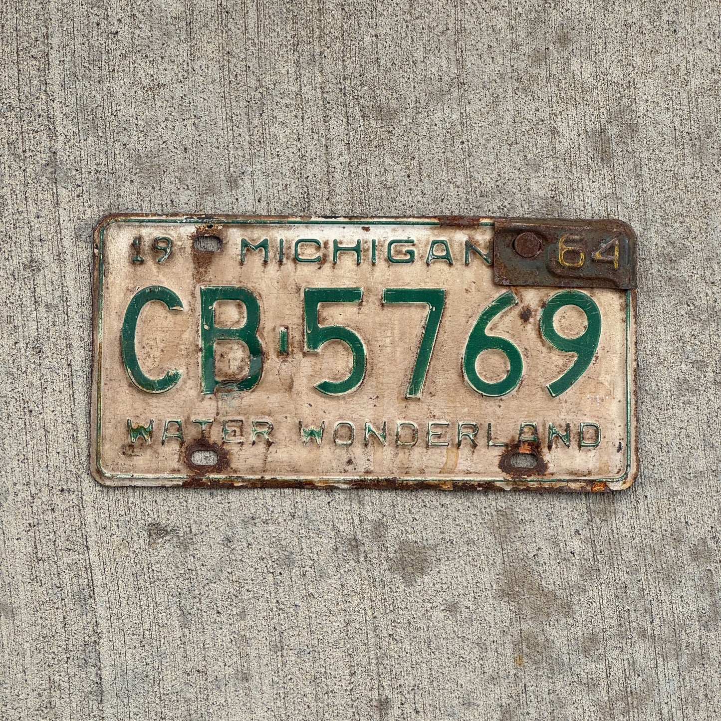 Photo of a 1962 1964 Michigan License Plate Auto Tag Garage Decor Vintage CB 5769 with original patina