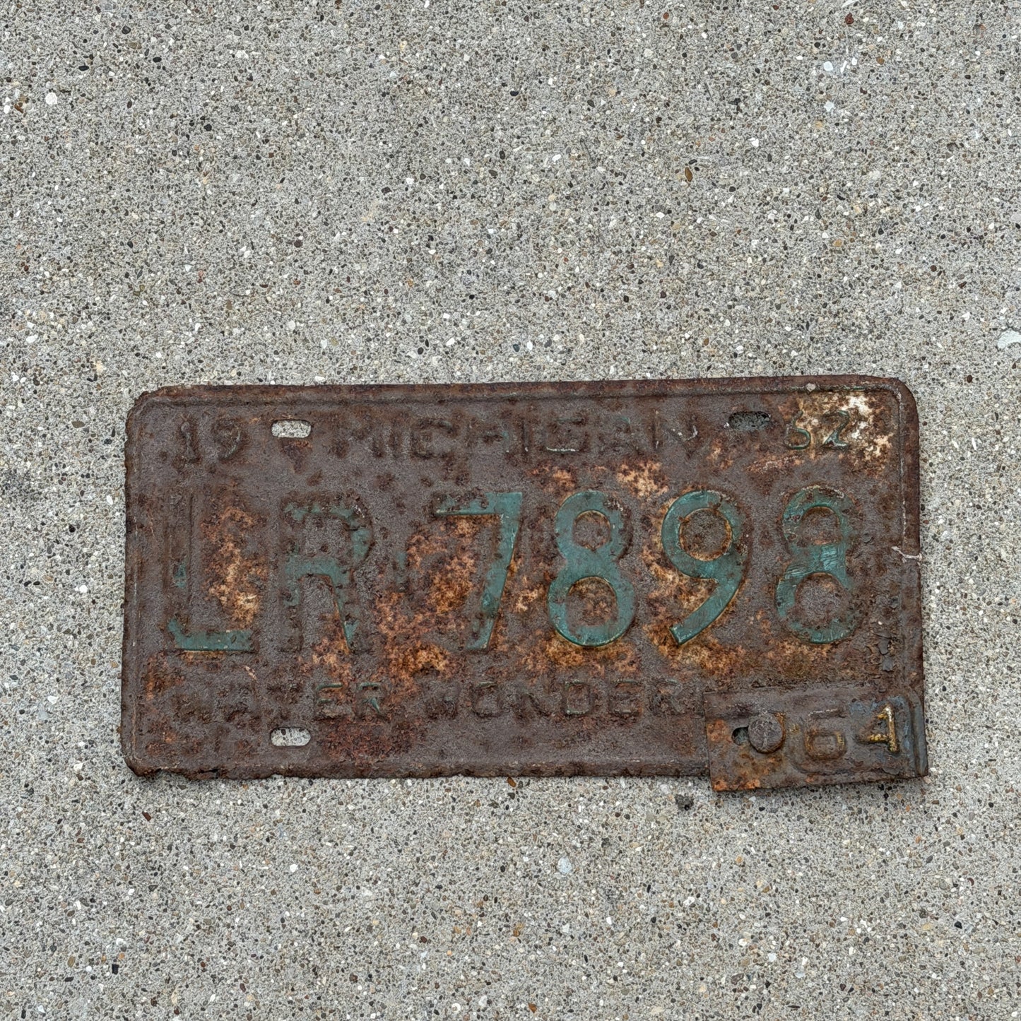 Photo of a 1962 1964 Michigan License Plate Auto Tag Garage Decor Vintage LR 7898 with original patina