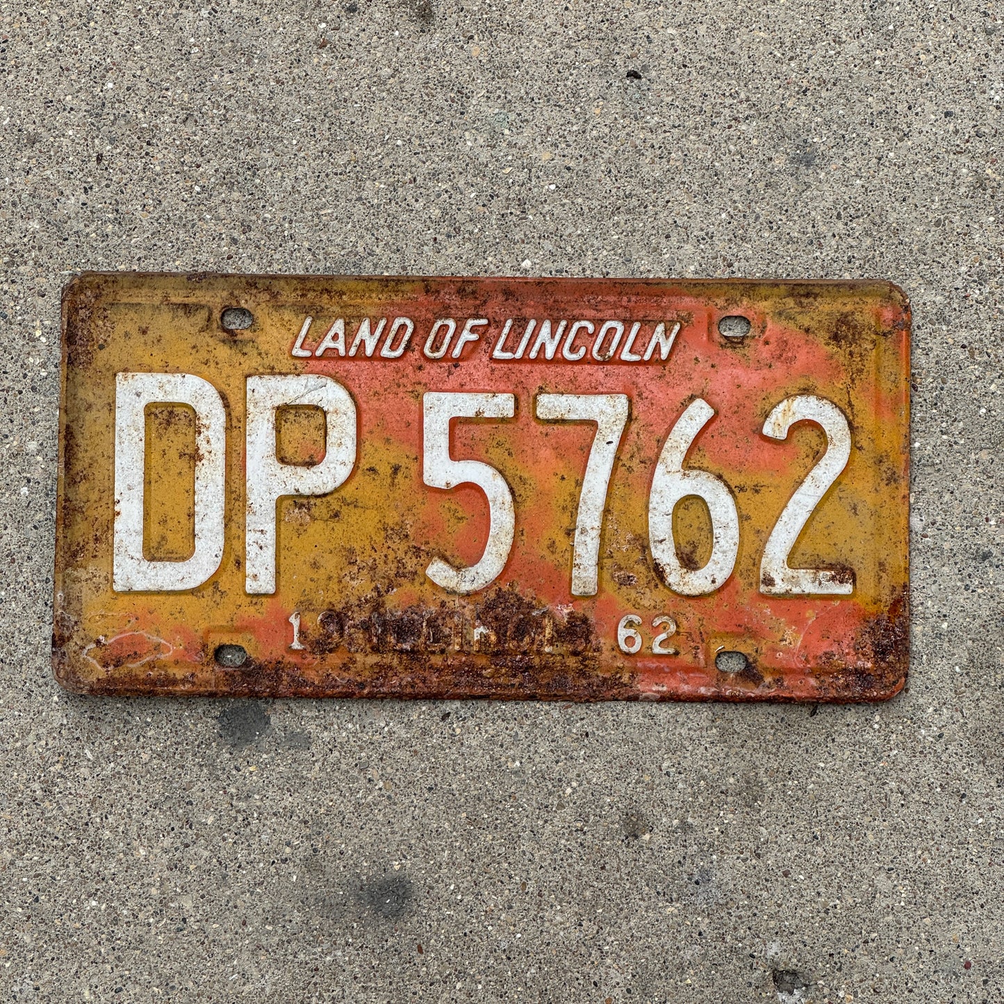 Photo of a 1962 Illinois License Plate Auto Tag 1 Vintage Garage DP 5762 with original patina