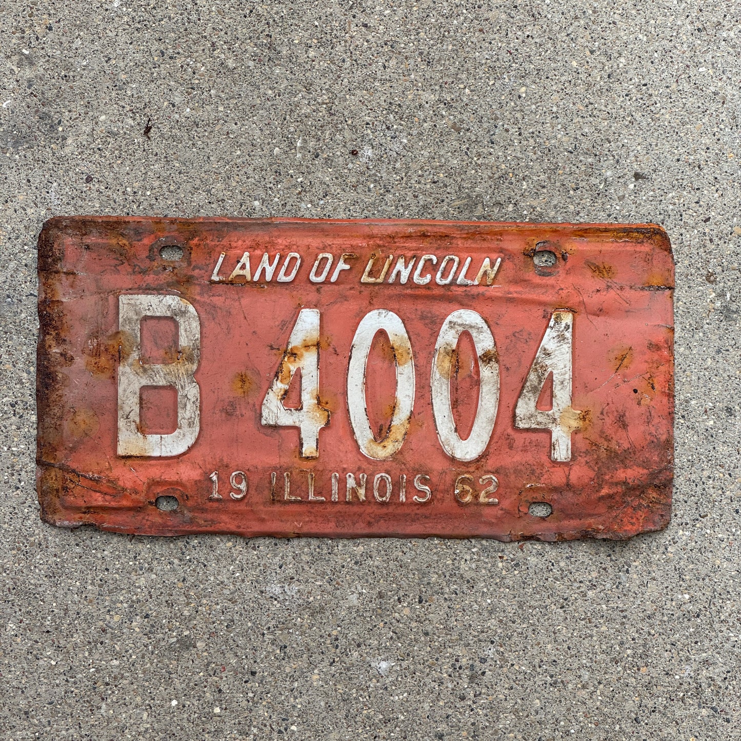 Photo of a 1962 Illinois Truck License Plate Auto Tag Garage Decor Vintage B 4004 with original patina
