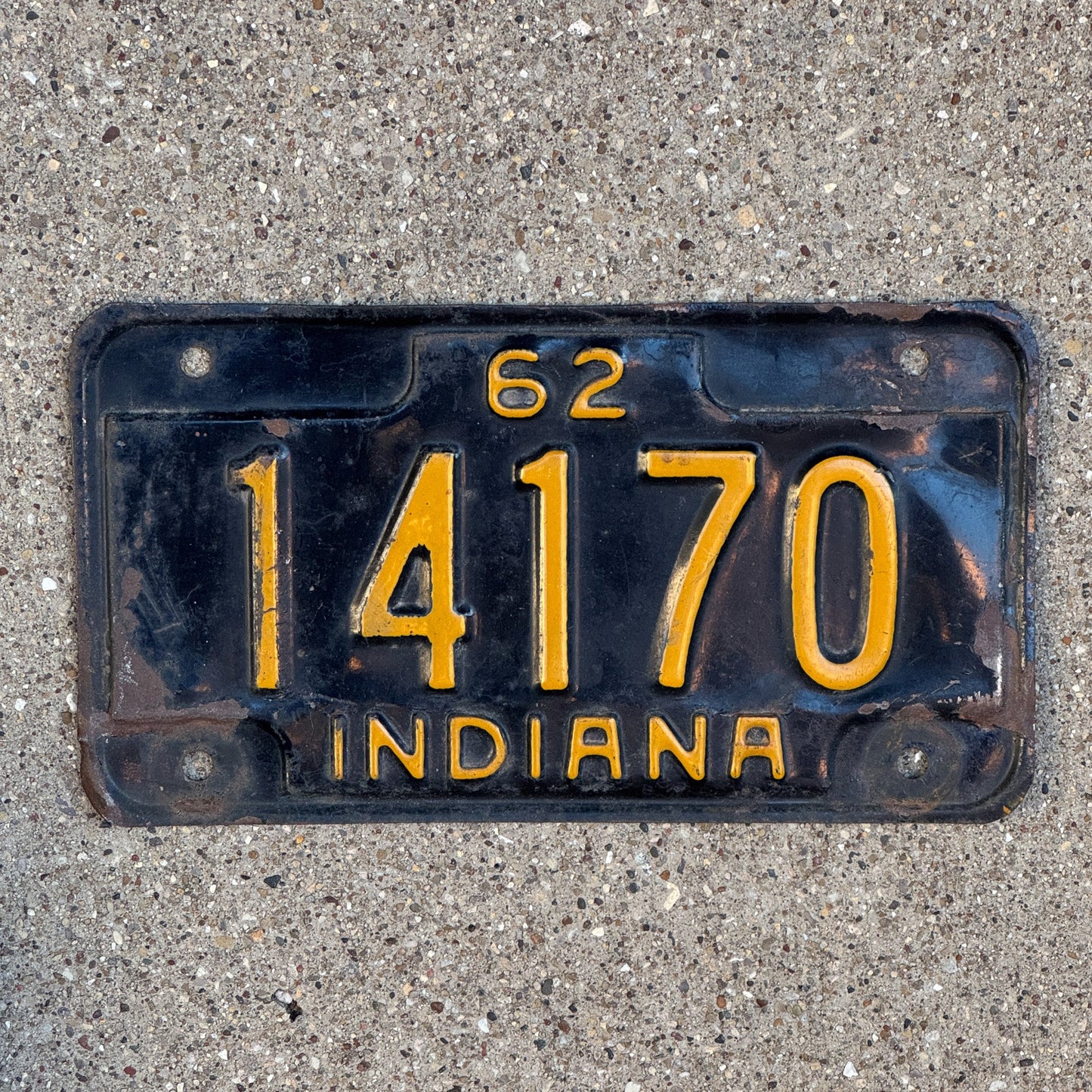 Photo of a 1962 Indiana Motorcycle License Plate Auto Tag Garage Decor Vintage 14170 with original patina