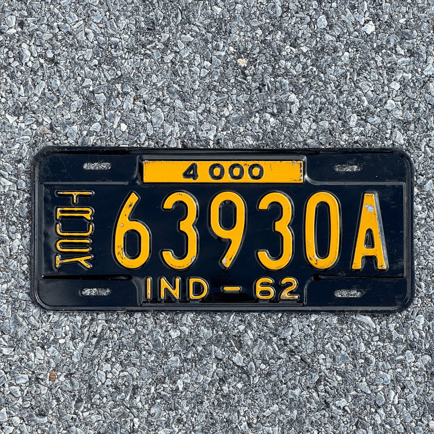 Photo of a 1962 Indiana Truck License Plate Auto Tag Garage Decor Vintage 63930A