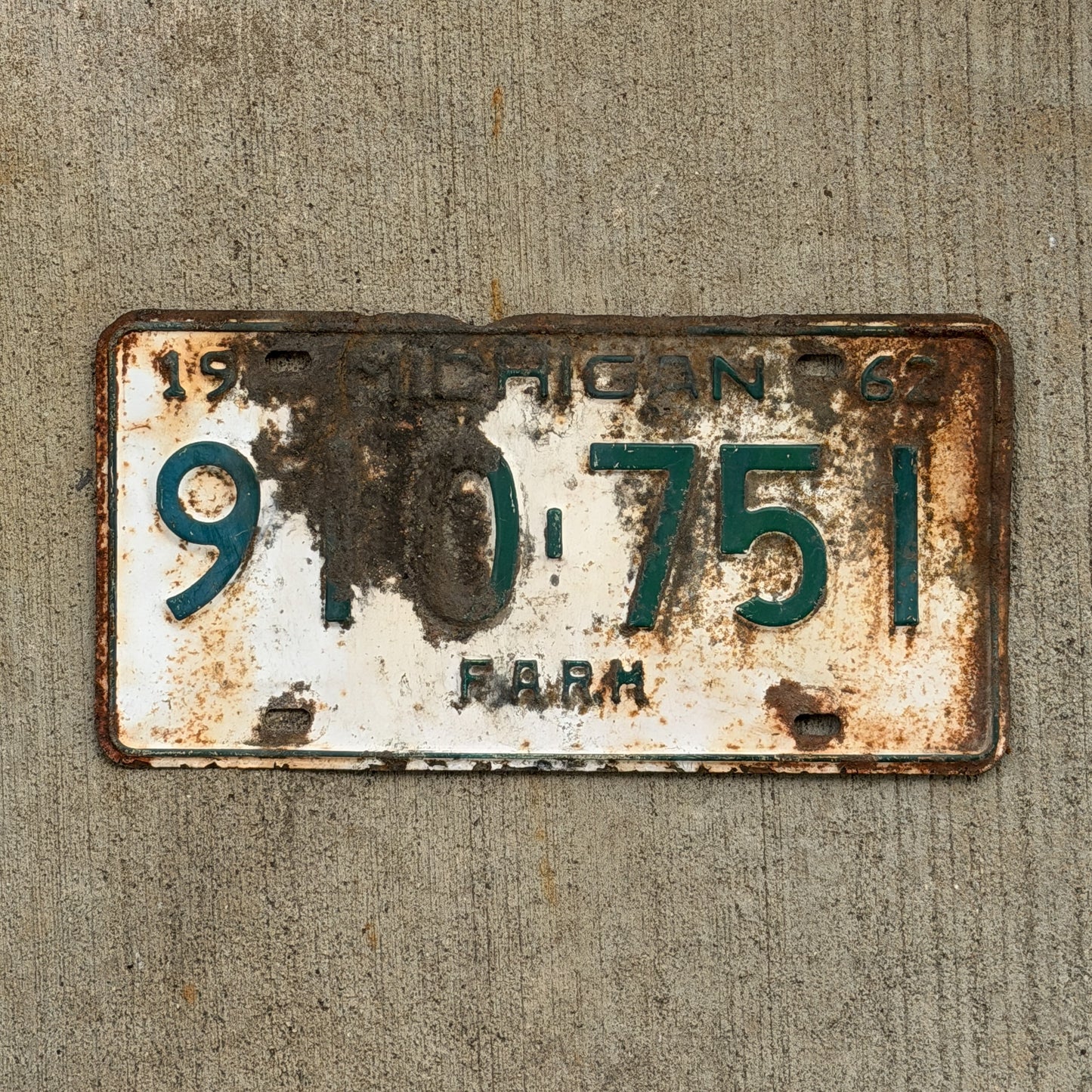Photo of a 1962 Michigan Farm License Plate Auto Tag Garage Decor Vintage 910 751 with original patina