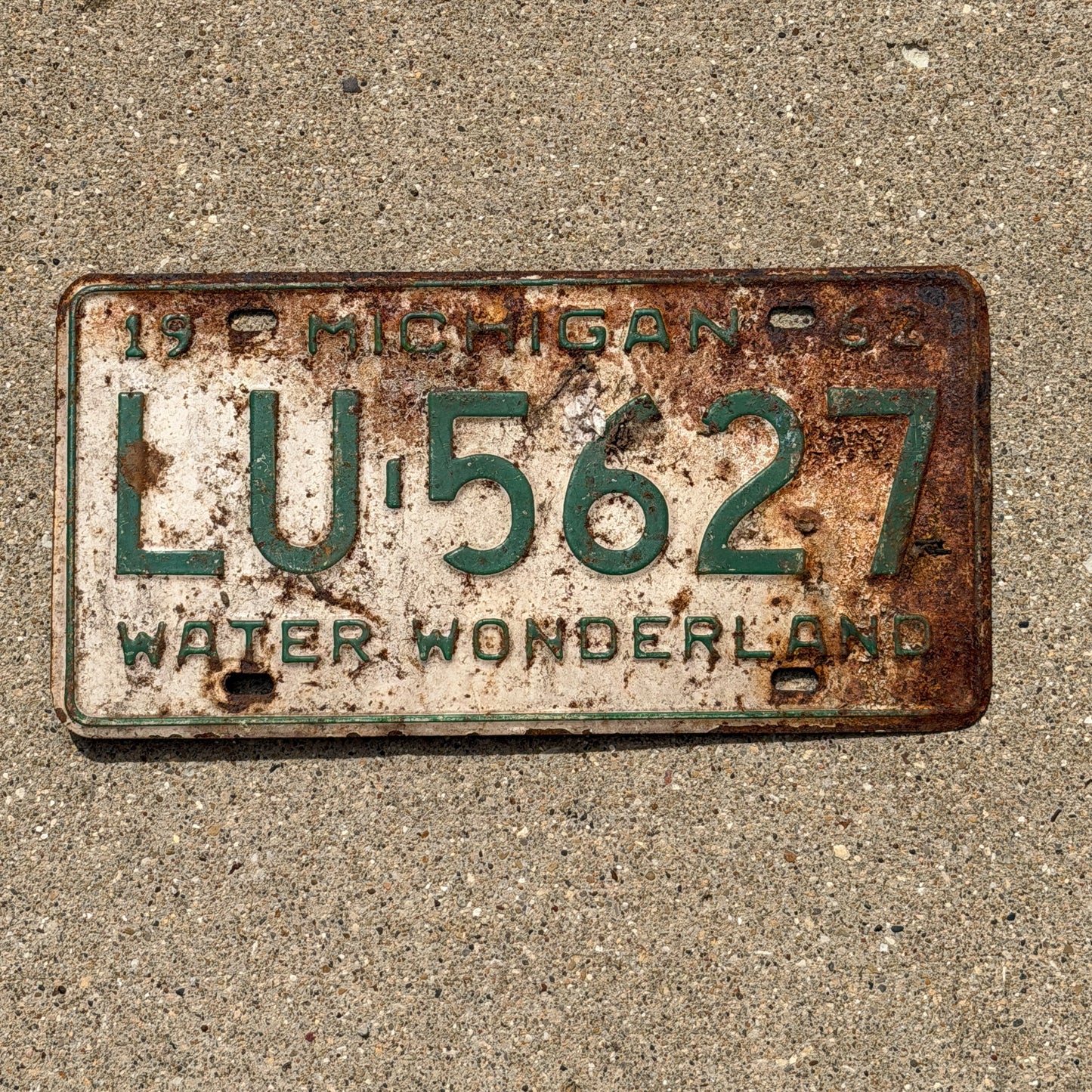 Photo of a 1962 Michigan License Plate Auto Tag Garage Decor Vintage LU 5627 with original patina