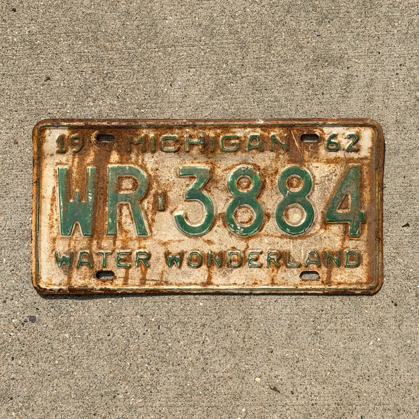 Photo of a 1962 Michigan License Plate Auto Tag Garage Decor Vintage WR 3884 with original patina