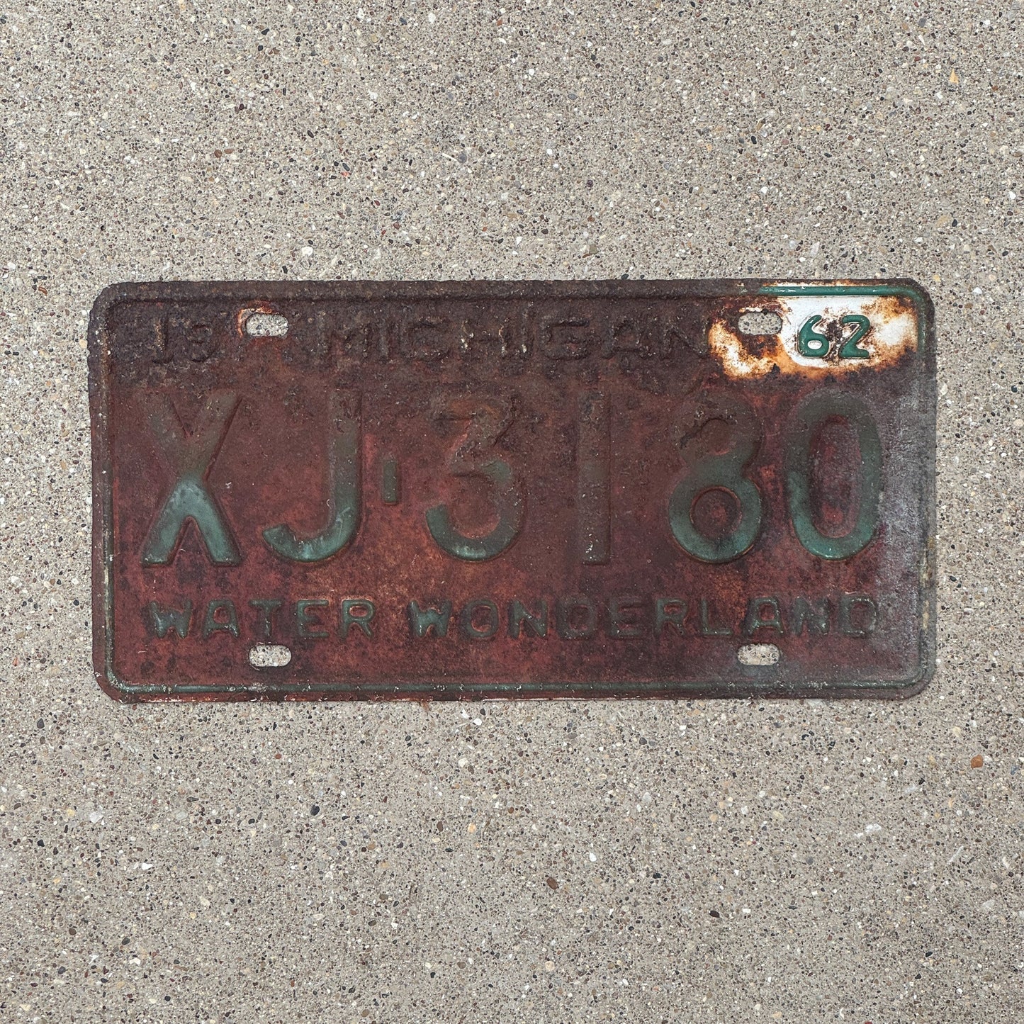 Photo of a 1962 Michigan License Plate Auto Tag Garage Decor Vintage XJ 3180