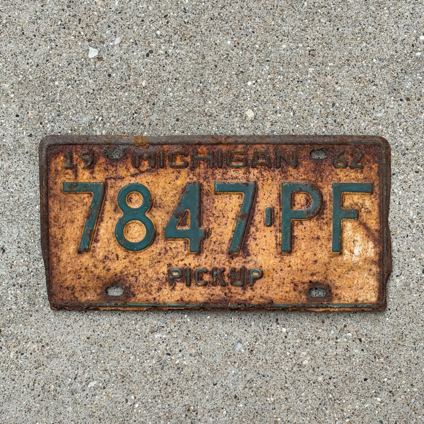 Photo of a 1962 Michigan Truck License Plate Auto Tag Garage Decor Vintage Pickup 7847 PF with original patina