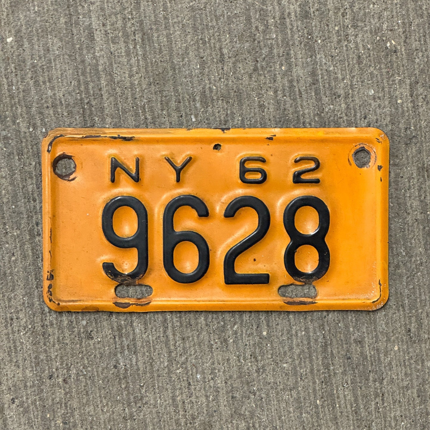 Photo of a 1962 New York Motorcycle License Plate Auto Tag Garage Decor Vintage 9628 with original patina