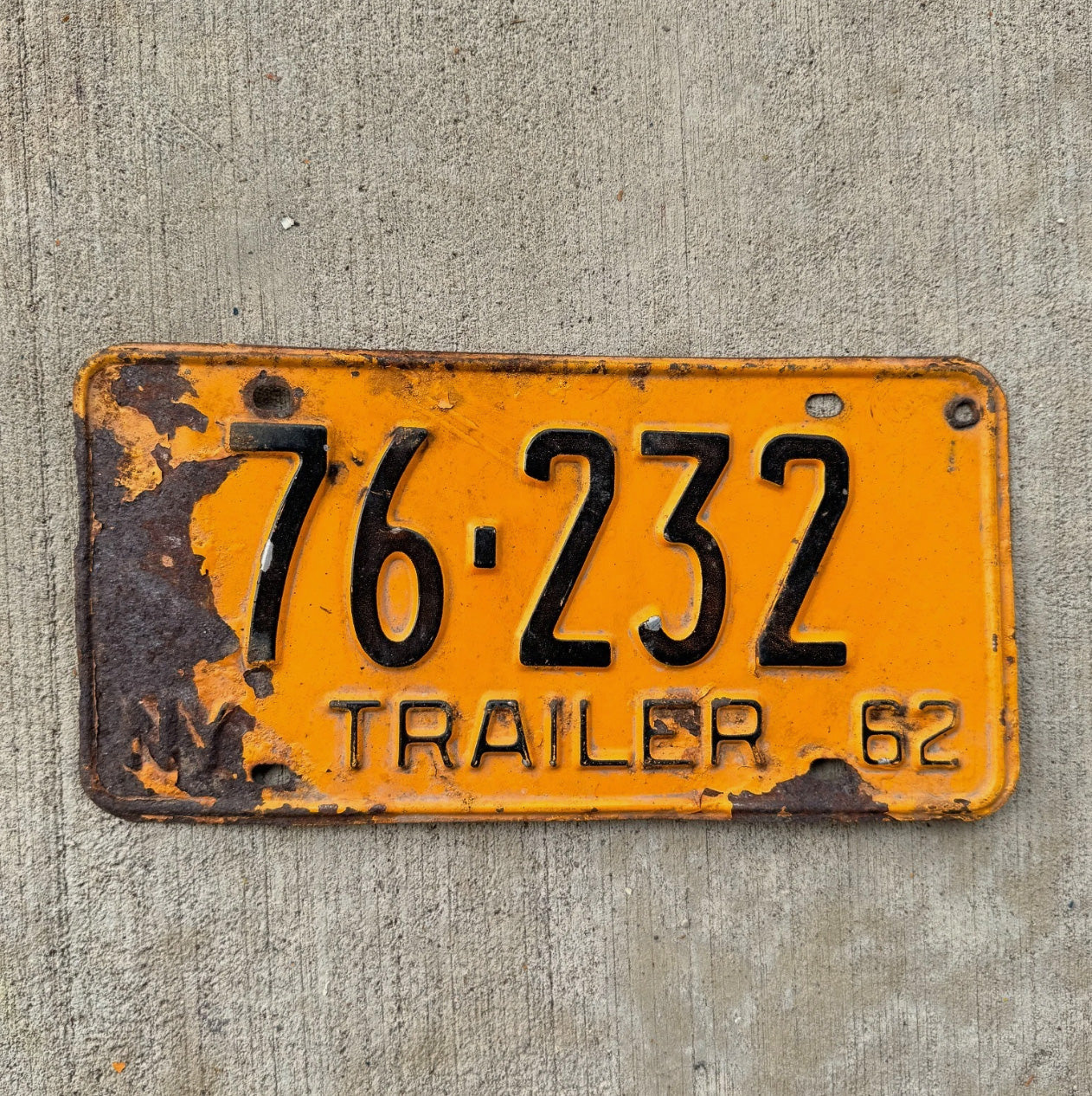 Photo of a 1962 New York Trailer License Plate Auto Tag Garage Decor Vintage Orange 76 232