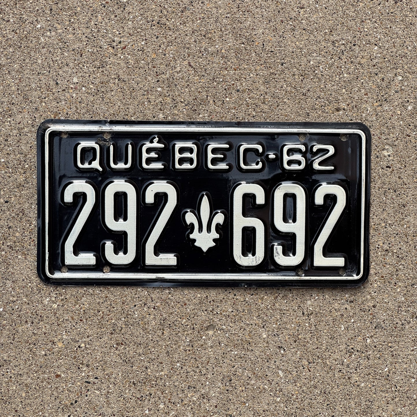 Photo of a 1962 Quebec License Plate Auto Tag Garage Decor Vintage 292 692 with original patina