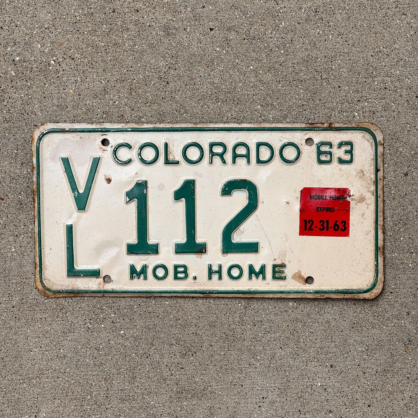 Photo of a 1963 Colorado Mobile Home License Plate Auto Tag Garage Decor Vintage VL 112