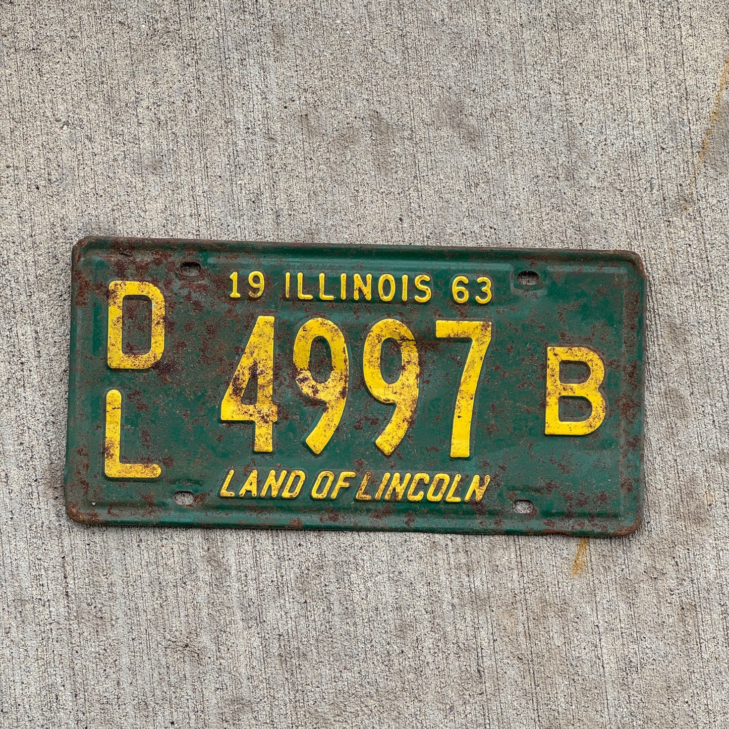 Photo of a 1963 Illinois Dealer License Plate Auto Tag 2 Vintage Garage 4997 B with original patina