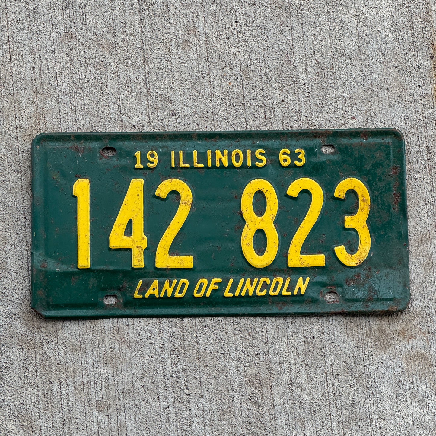 Photo of a 1963 Illinois License Plate Auto Tag 2 Vintage Garage 142 823 with original patina