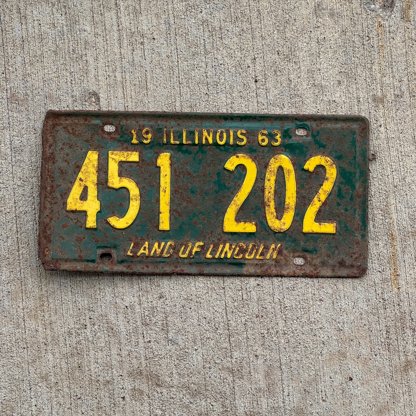 Photo of a 1963 Illinois License Plate Auto Tag Garage Decor Vintage 451 202 with original patina