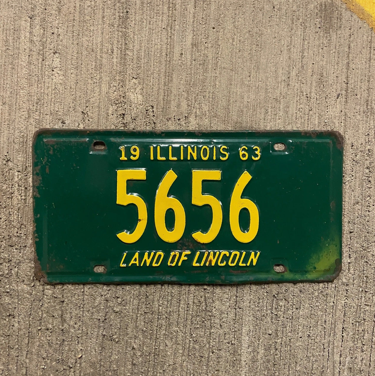 Photo of a 1963 Illinois License Plate Auto Tag Garage Decor Vintage Low Number Four Digit 5656 with original patina
