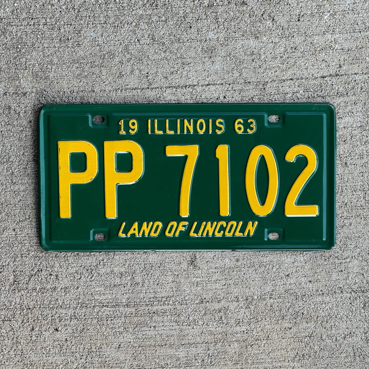 Photo of a 1963 Illinois License Plate Auto Tag Garage Decor Vintage PP 7102 with original patina
