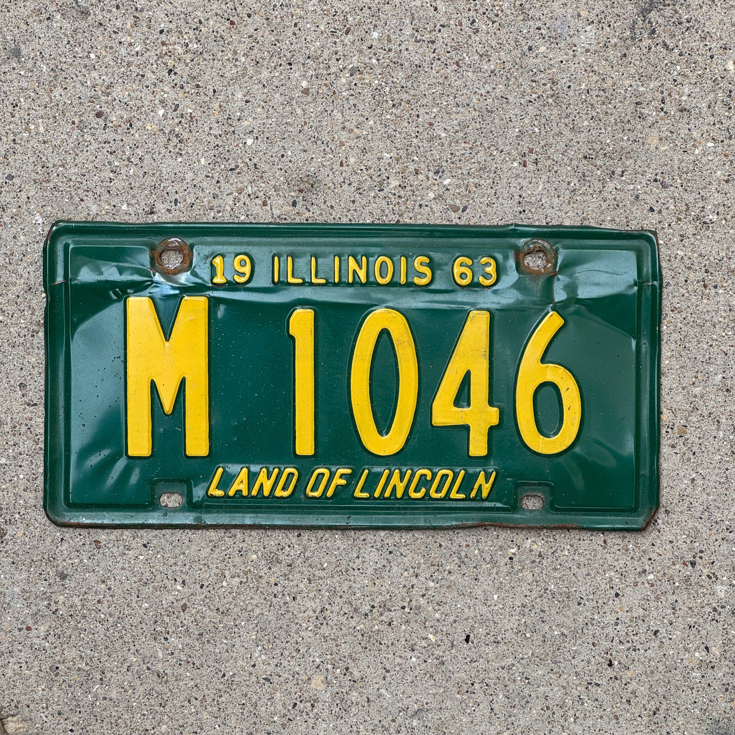 Photo of a 1963 Illinois Municipal License Plate Auto Tag 1 Vintage Garage M 1046 with original patina