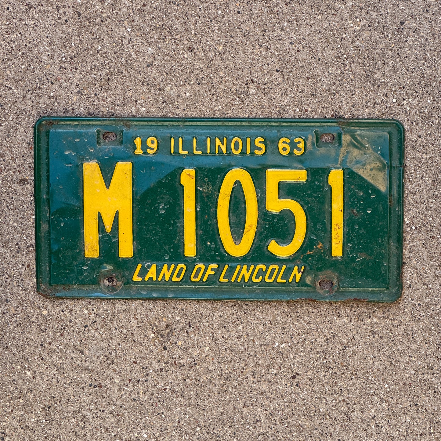 Photo of a 1963 Illinois Municipal License Plate Auto Tag 1 Vintage Garage M 1051 with original patina
