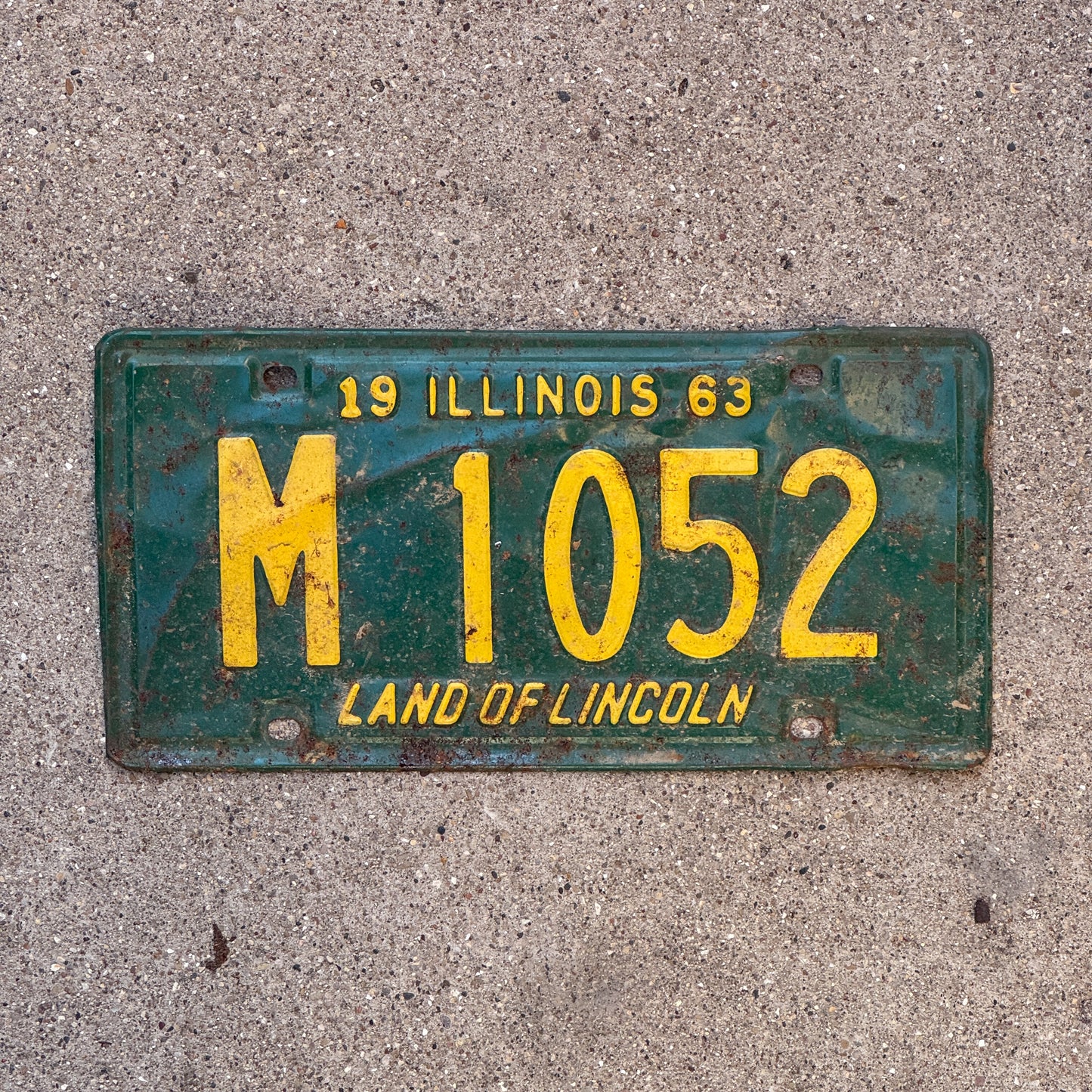 Photo of a 1963 Illinois Municipal License Plate Auto Tag 1 Vintage Garage M 1052 with original patina