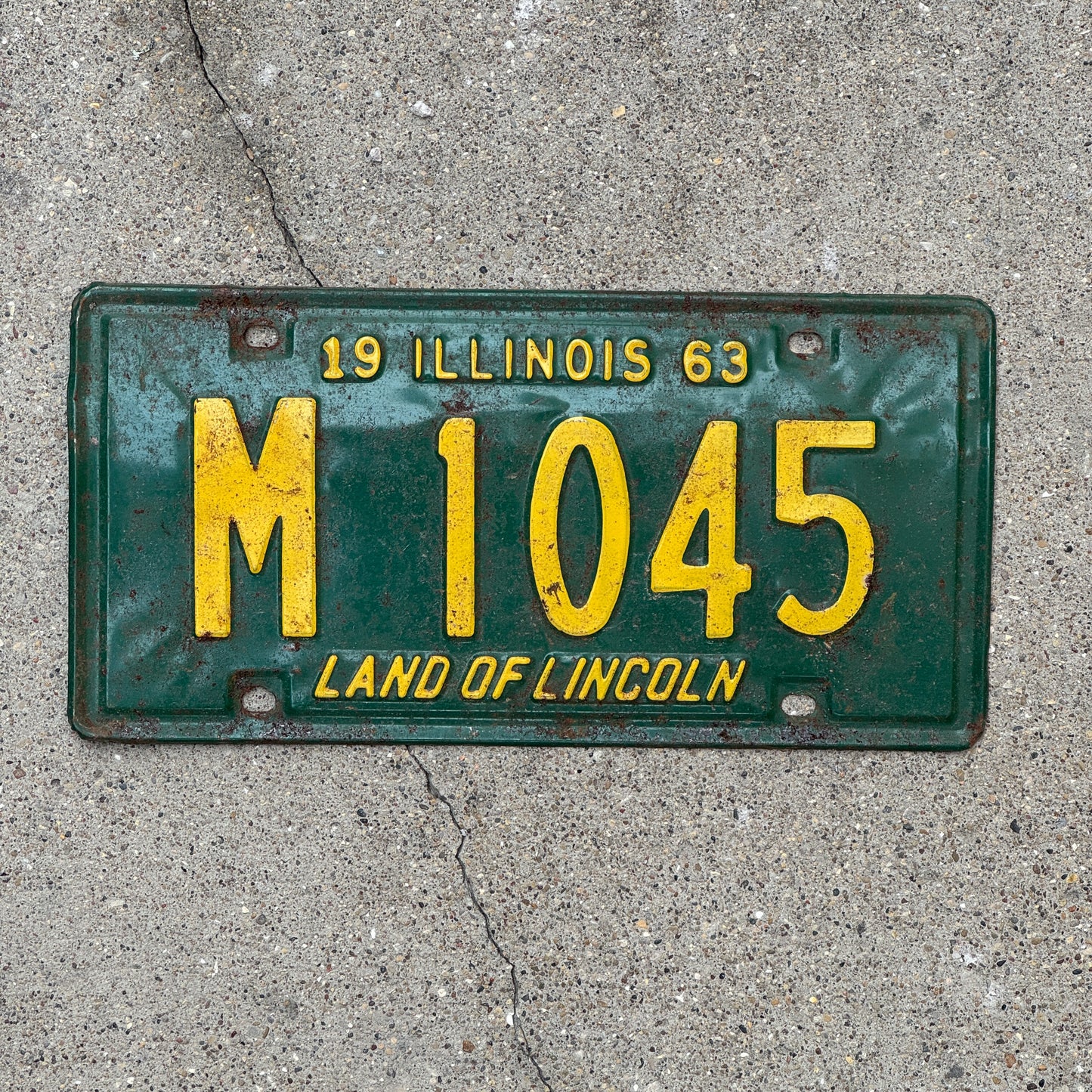 Photo of a 1963 Illinois Municipal License Plate Auto Tag 2 Vintage Garage M 1045 with original patina