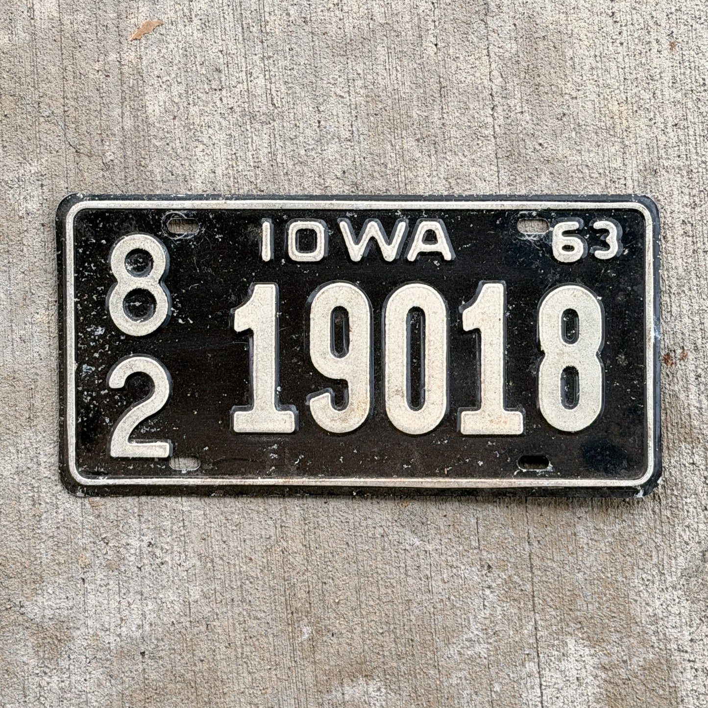 Photo of a 1963 Iowa License Plate Auto Tag Garage Decor Vintage 82 19018 with original patina
