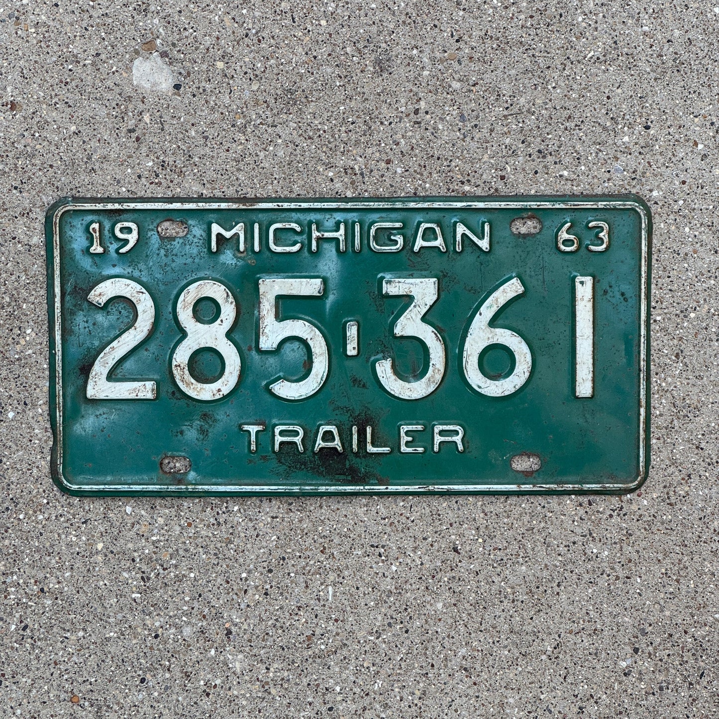 Photo of a 1963 Michigan Trailer License Plate Auto Tag Garage Decor Vintage 285 361