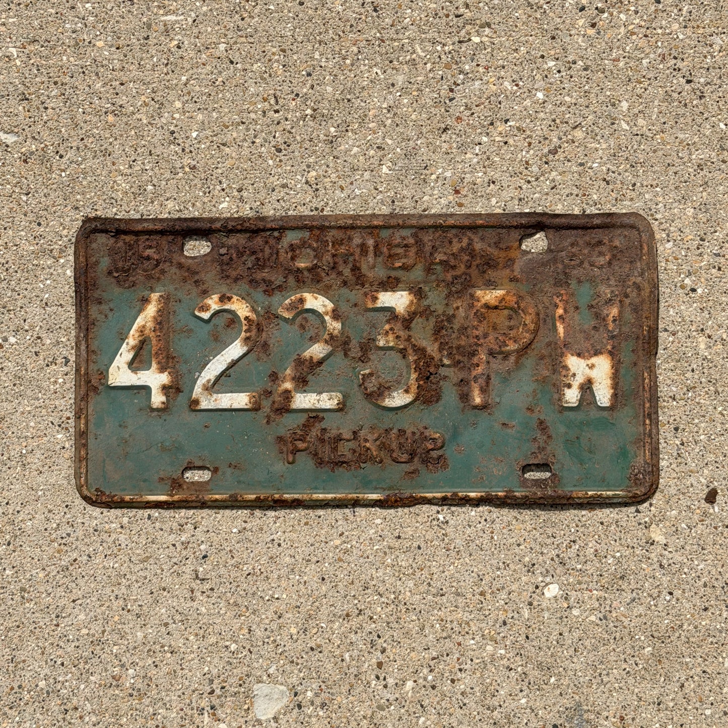 Photo of a 1963 Michigan Truck License Plate Auto Tag Garage Decor Vintage Pickup 4223 PW with original patina